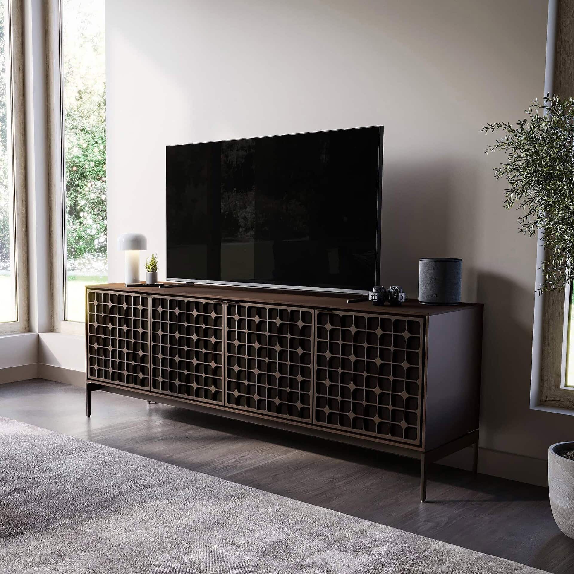 Modern wooden entertainment console with patterned front design for stylish TV setup.