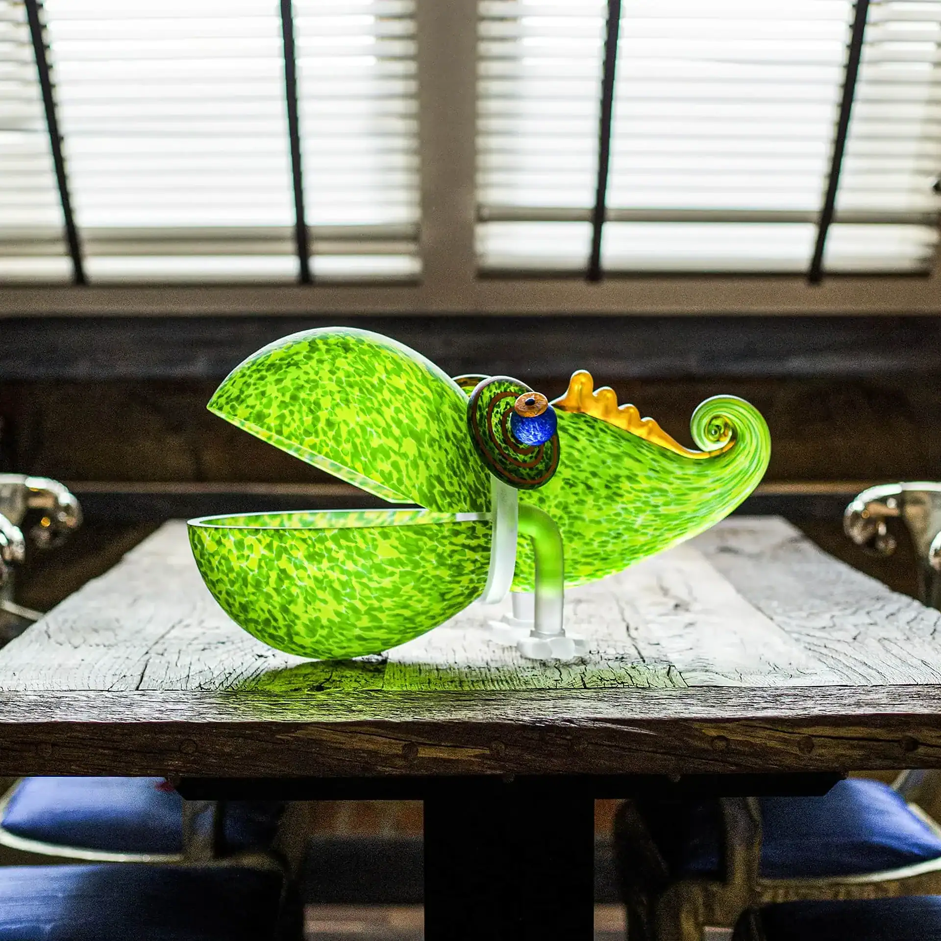 Chameleon Big Glass Bowl with an open mouth and curled tail sits on a rustic wooden table.