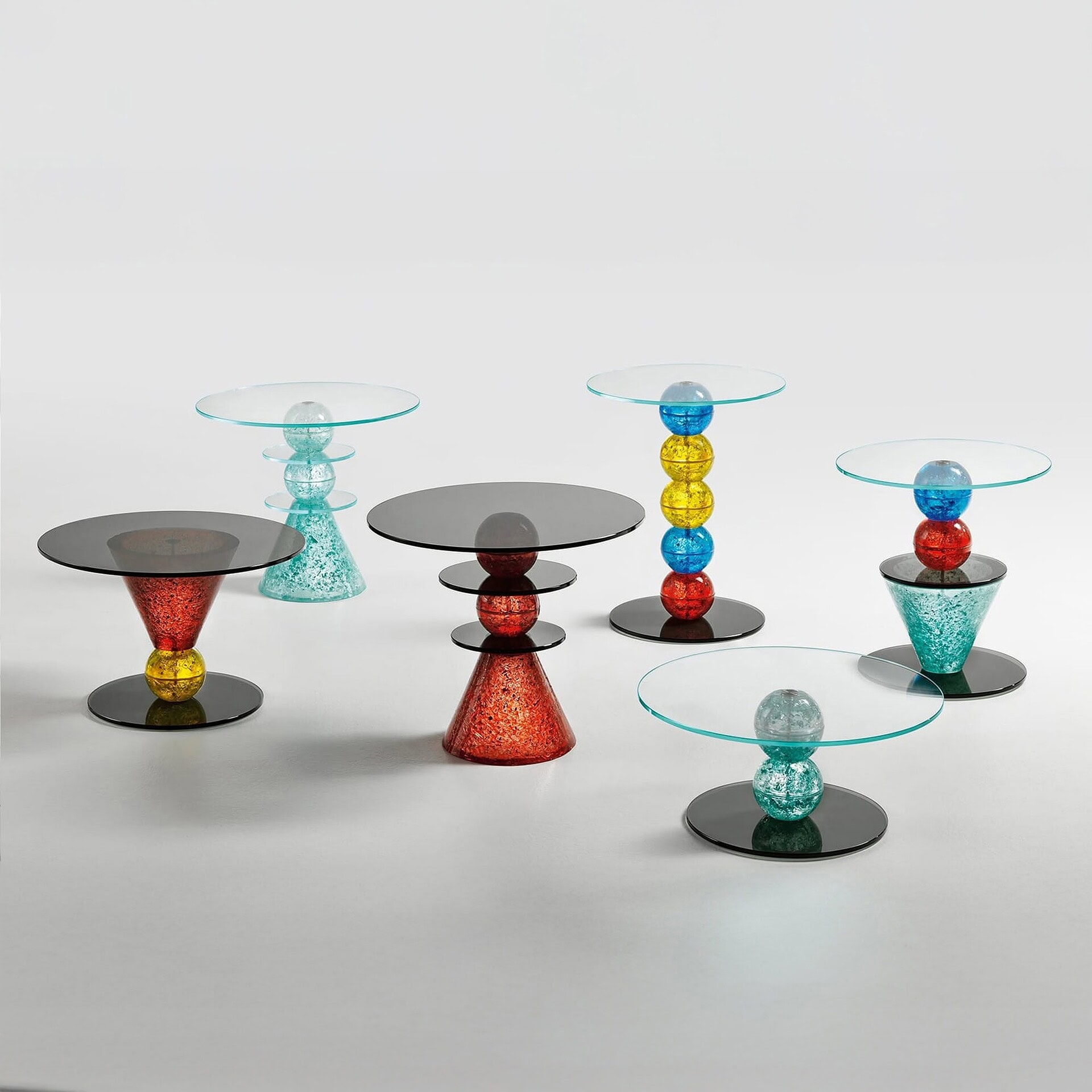 Group view of Il Paese delle Meraviglie Side Table collection in multiple sizes and colors