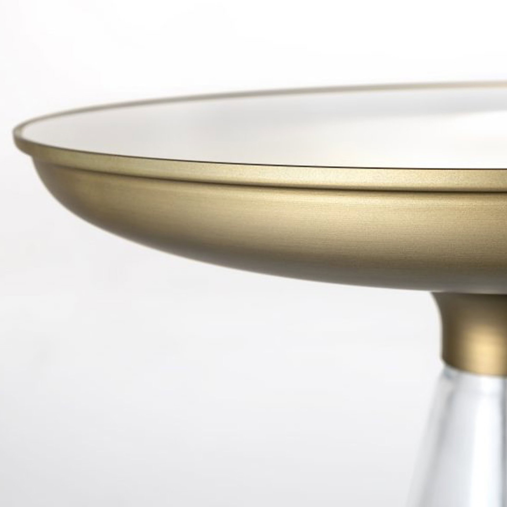 Close-up of the Accademia 40 Side Table’s bronze mirror glass top with satin brass edge detail.