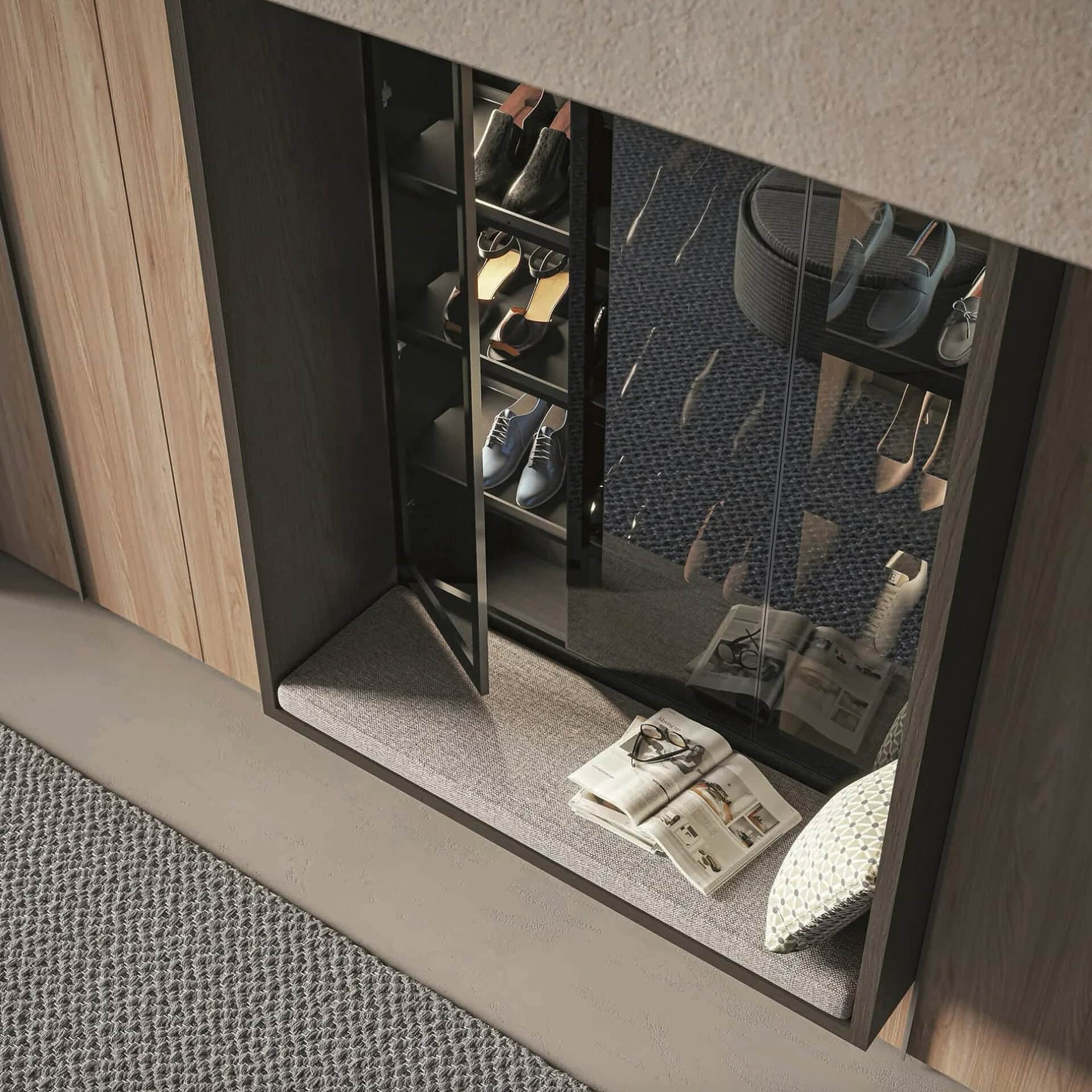 Shoe storage cabinet with mirrored doors and organized shoes inside.