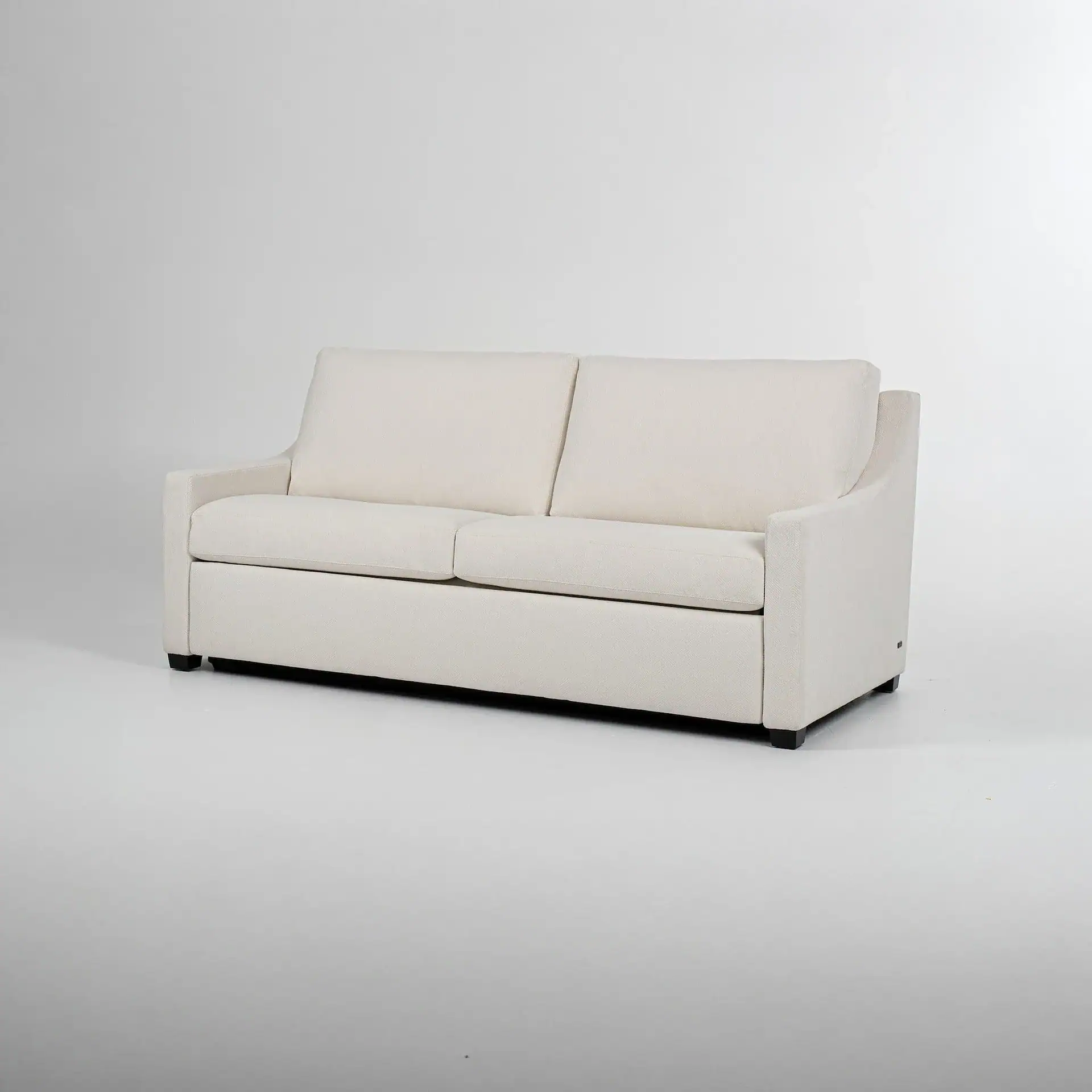A cream-colored, two-seater sofa with a modern design and textured fabric, shown against a light gray background.