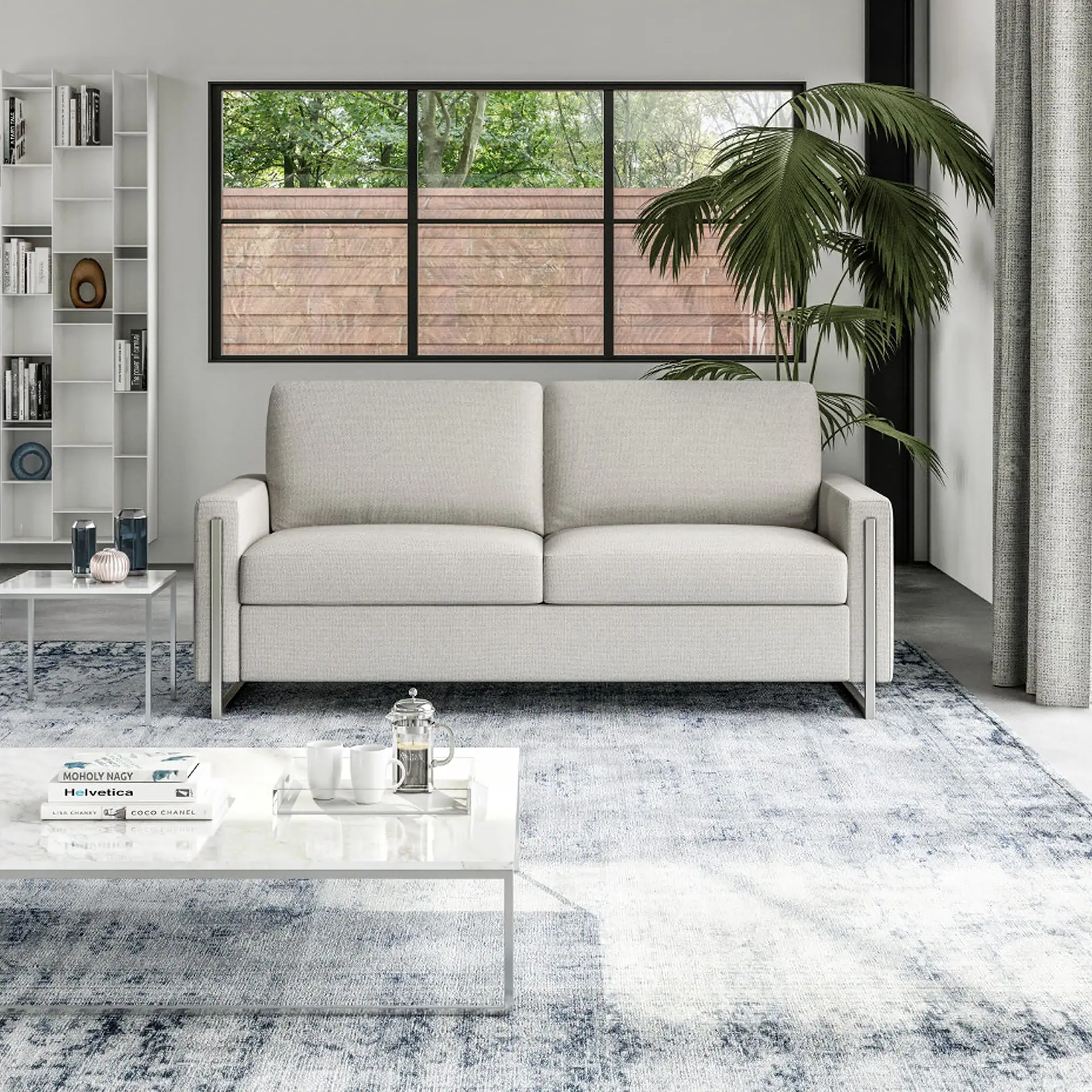 Sulley Comfort Sleeper Sofa in a modern living room with large window and indoor plant.