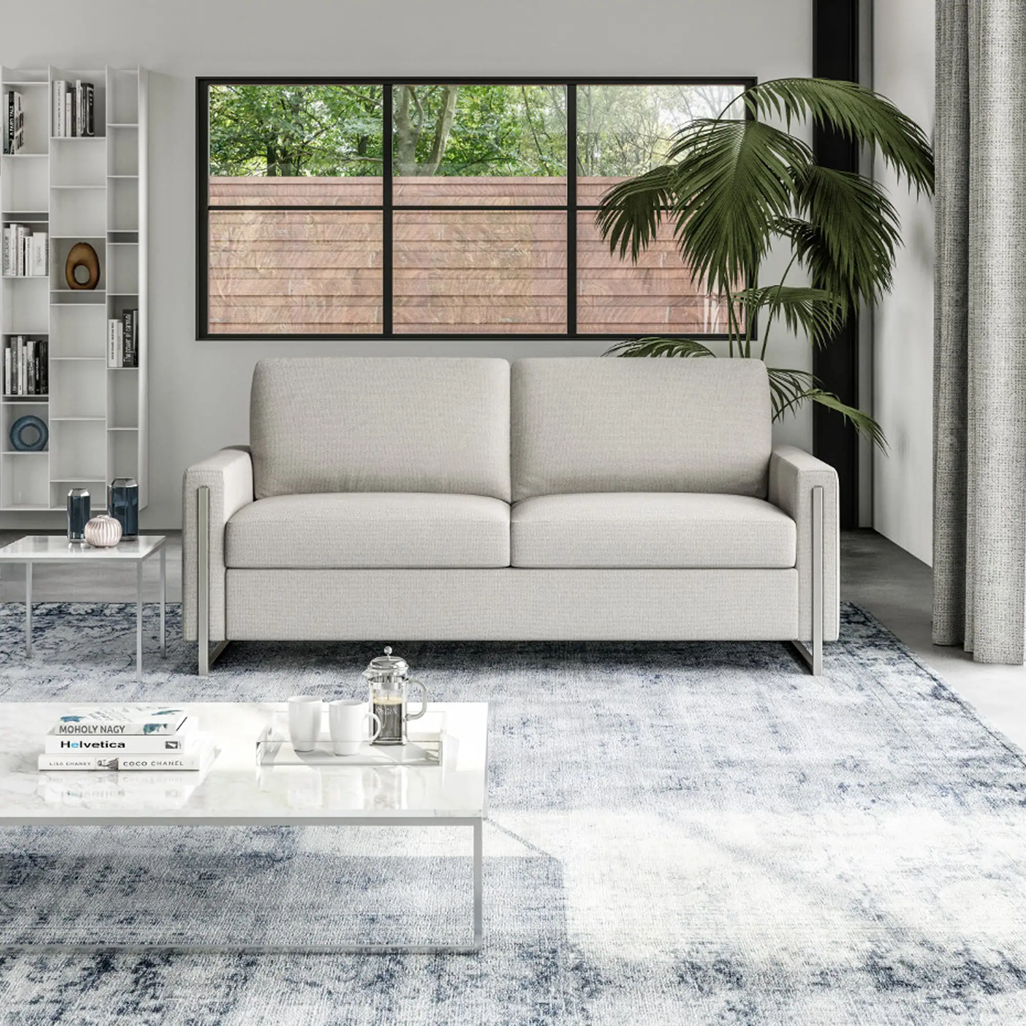 Sulley Comfort Sleeper Sofa in a modern living room with large window and indoor plant.