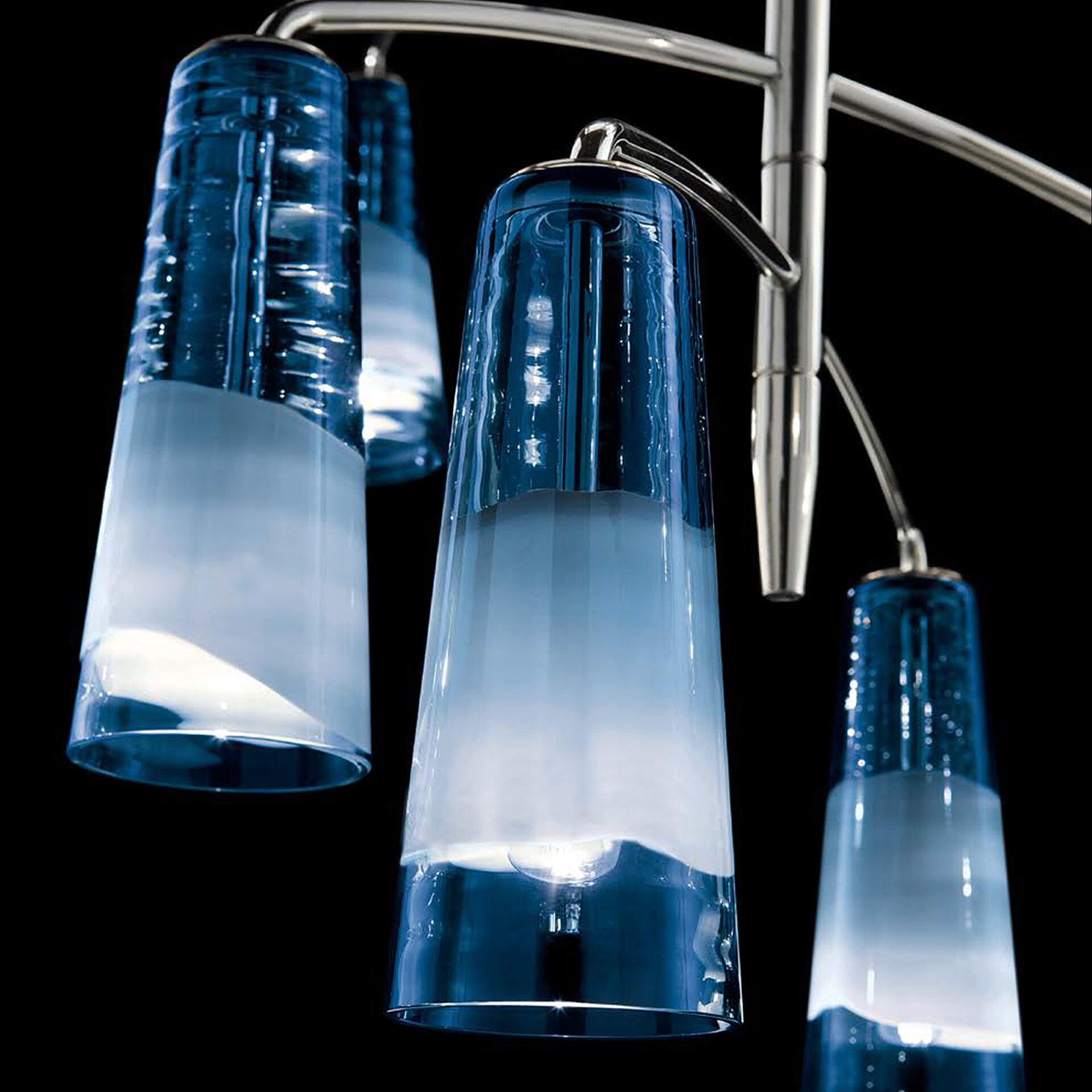 Elegant glass pendant lights with blue accents for contemporary home lighting.