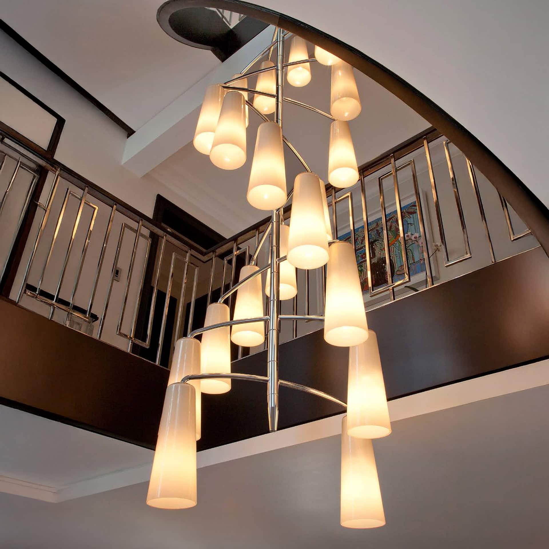 Stylish modern chandelier with glass shades illuminating a contemporary interior.