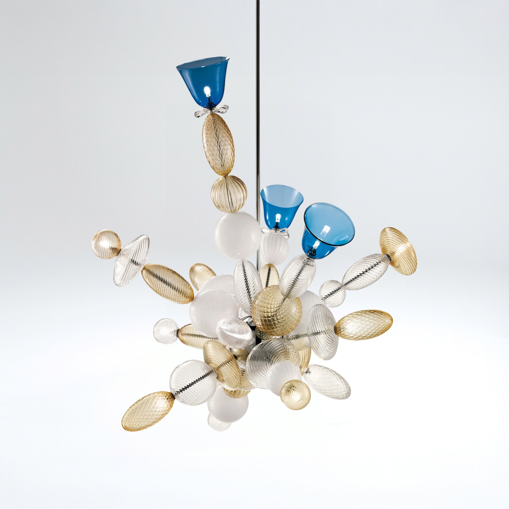 Contemporary glass art sculpture with blue, gold, and clear glass elements for stylish interior deco.
