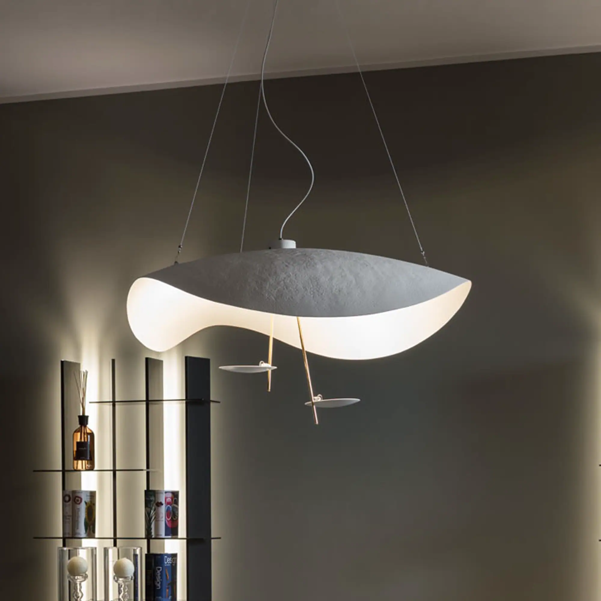 Lederam Manta S2 pendant light hanging from ceiling in modern room.