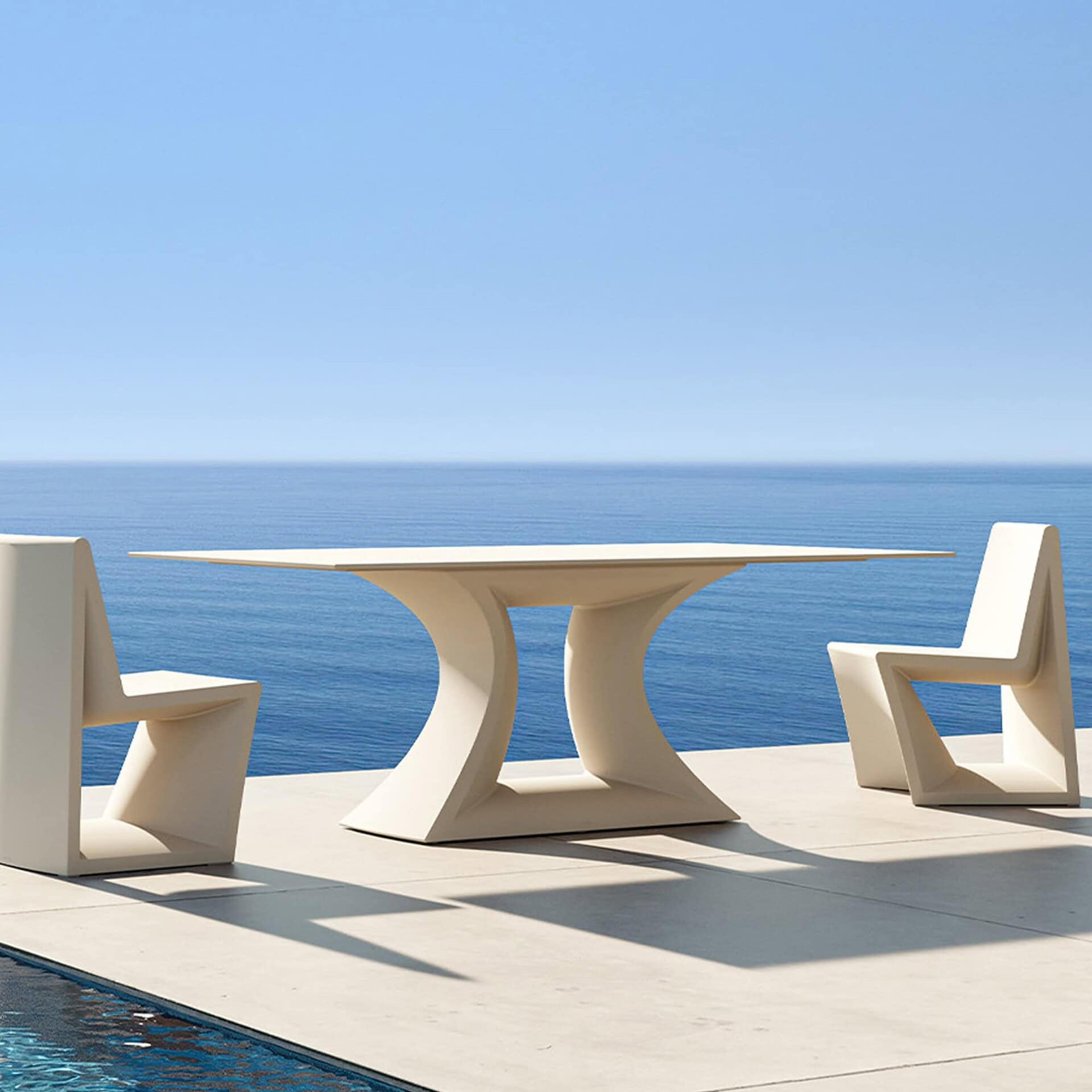 Modern Vondom outdoor dining table with two matching chairs by Sklar Furnishings.