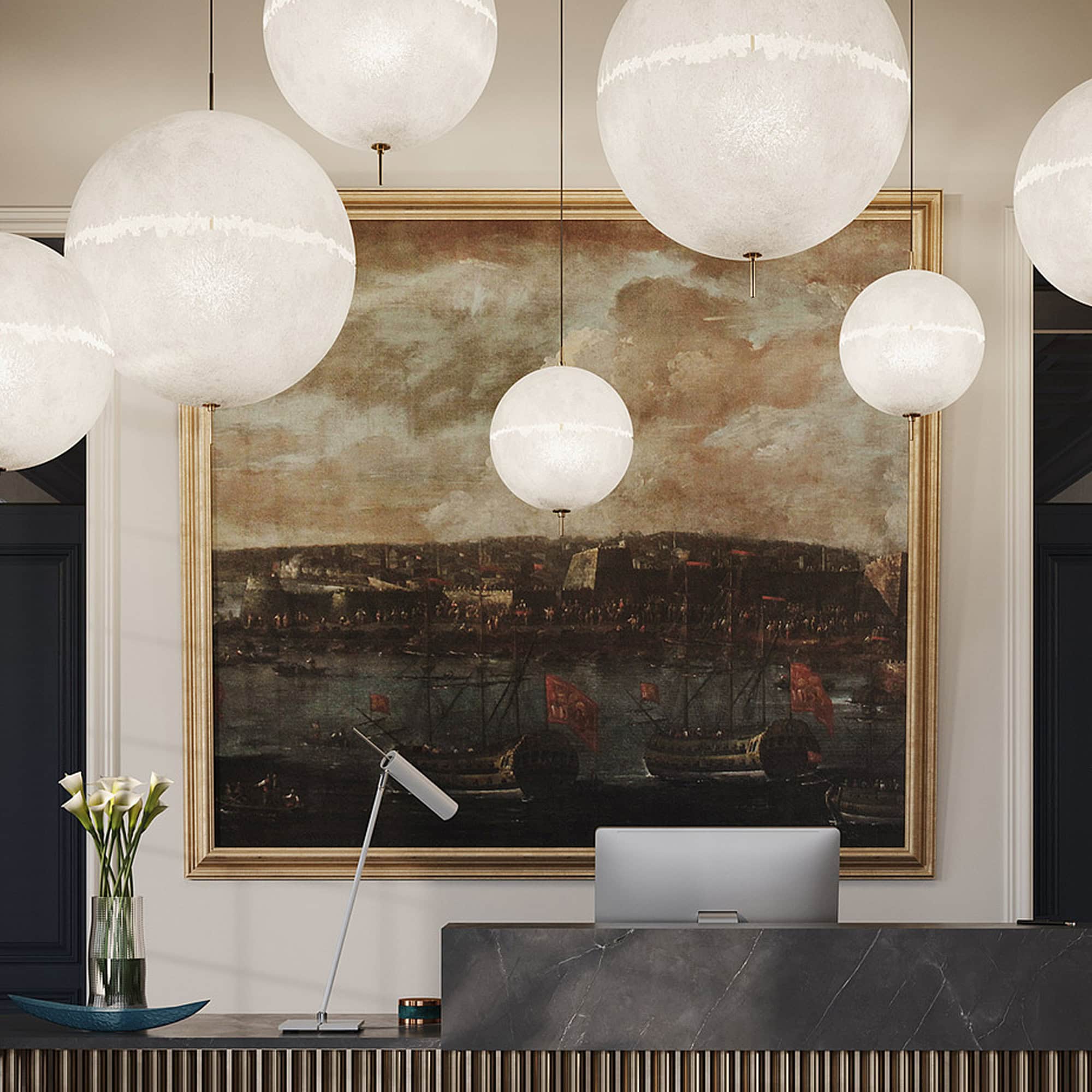 PostKrisi pendant lamps illuminating a workspace with a large painting in the background, blending modern and classic style.