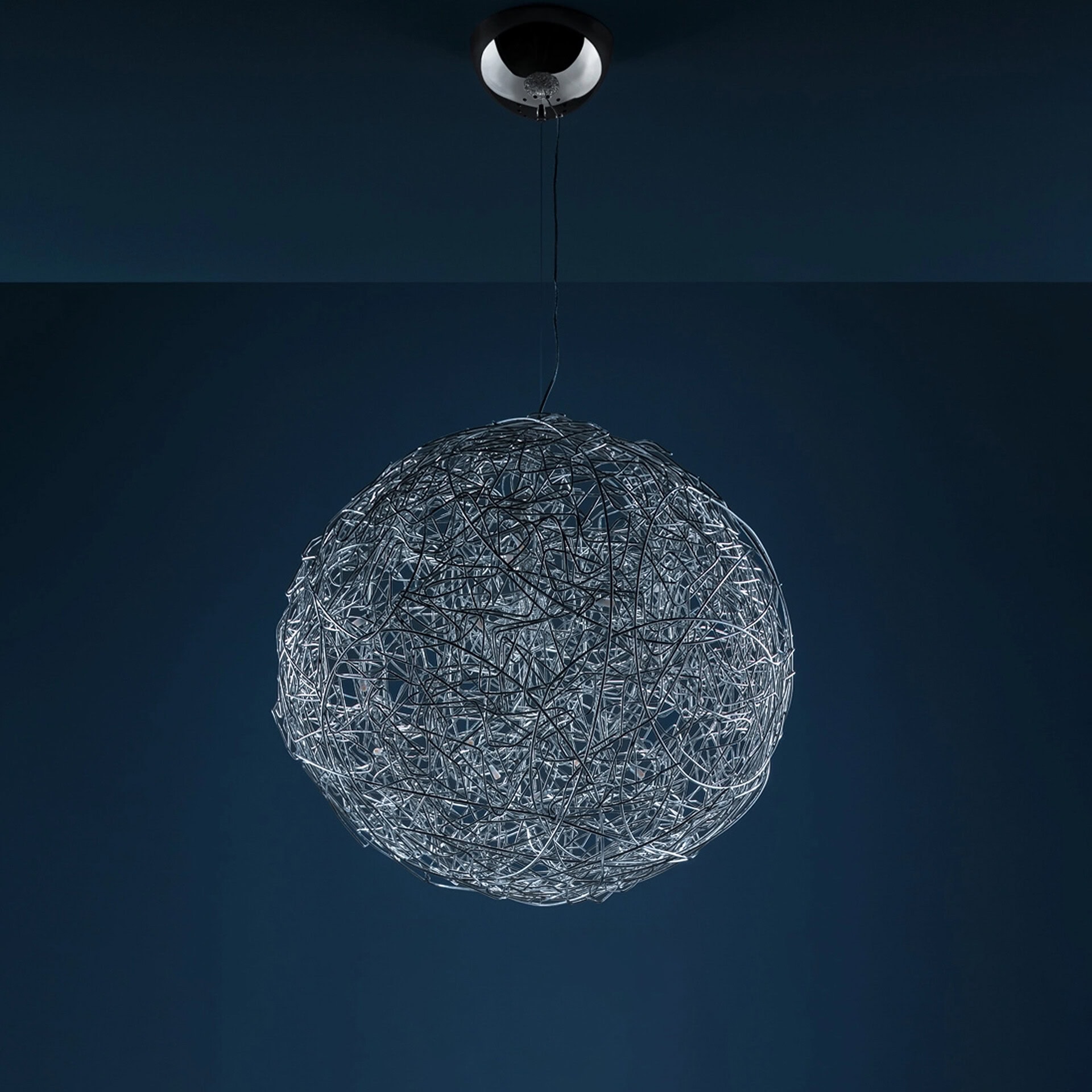 Pendant light with intricate wire design for contemporary interiors.