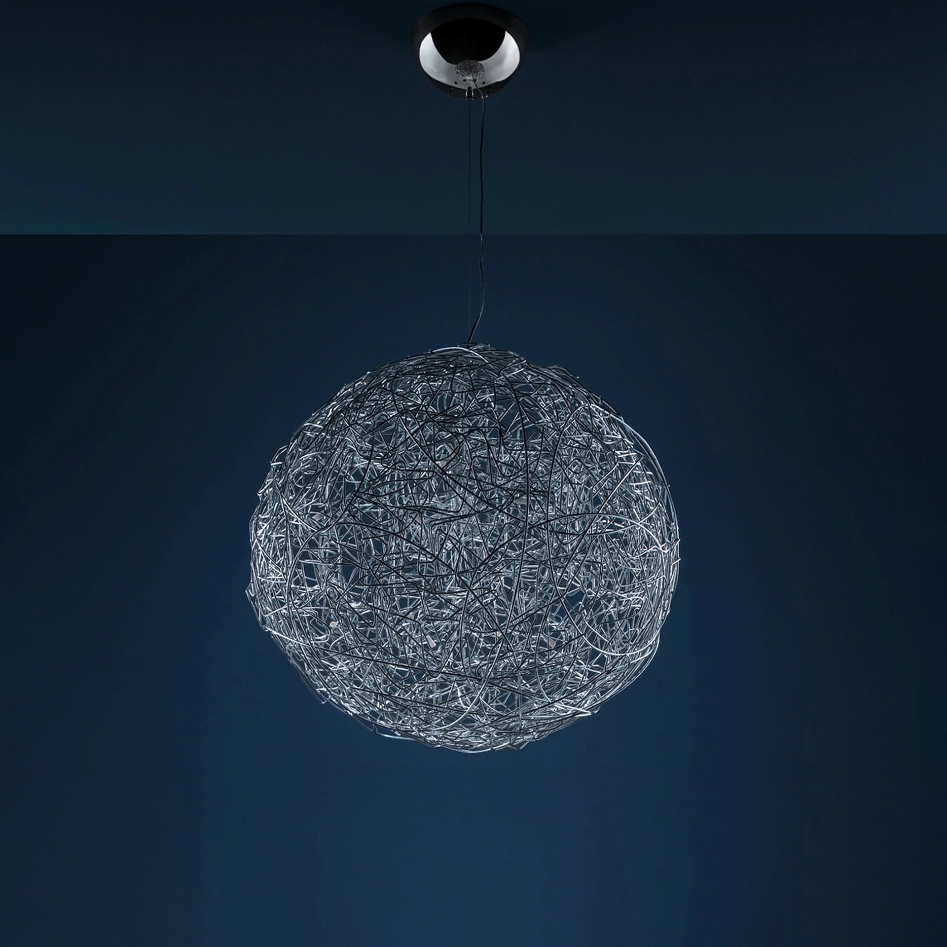 Pendant light with intricate wire design for contemporary interiors.