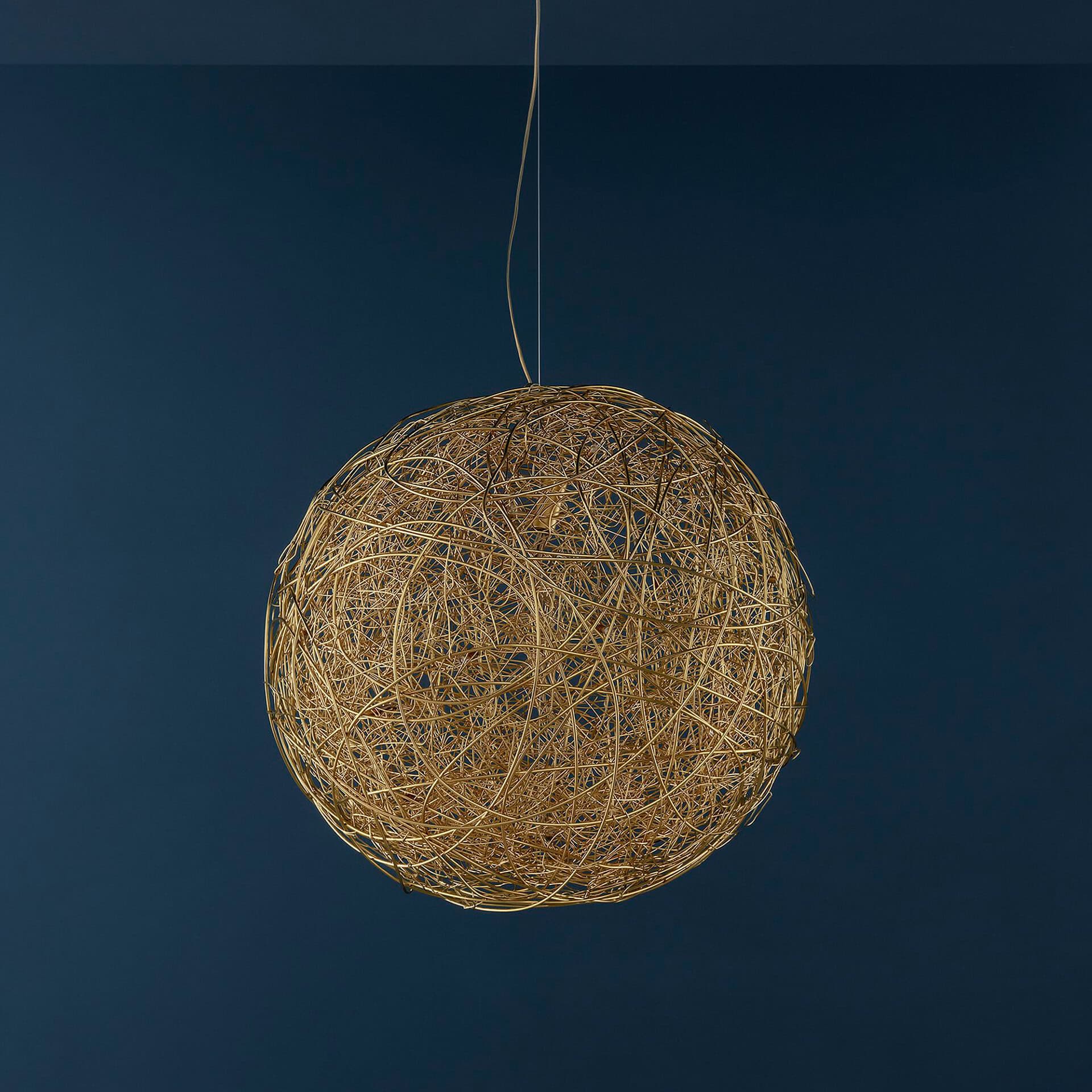 Woven rattan pendant light hanging from ceiling in a contemporary interior.