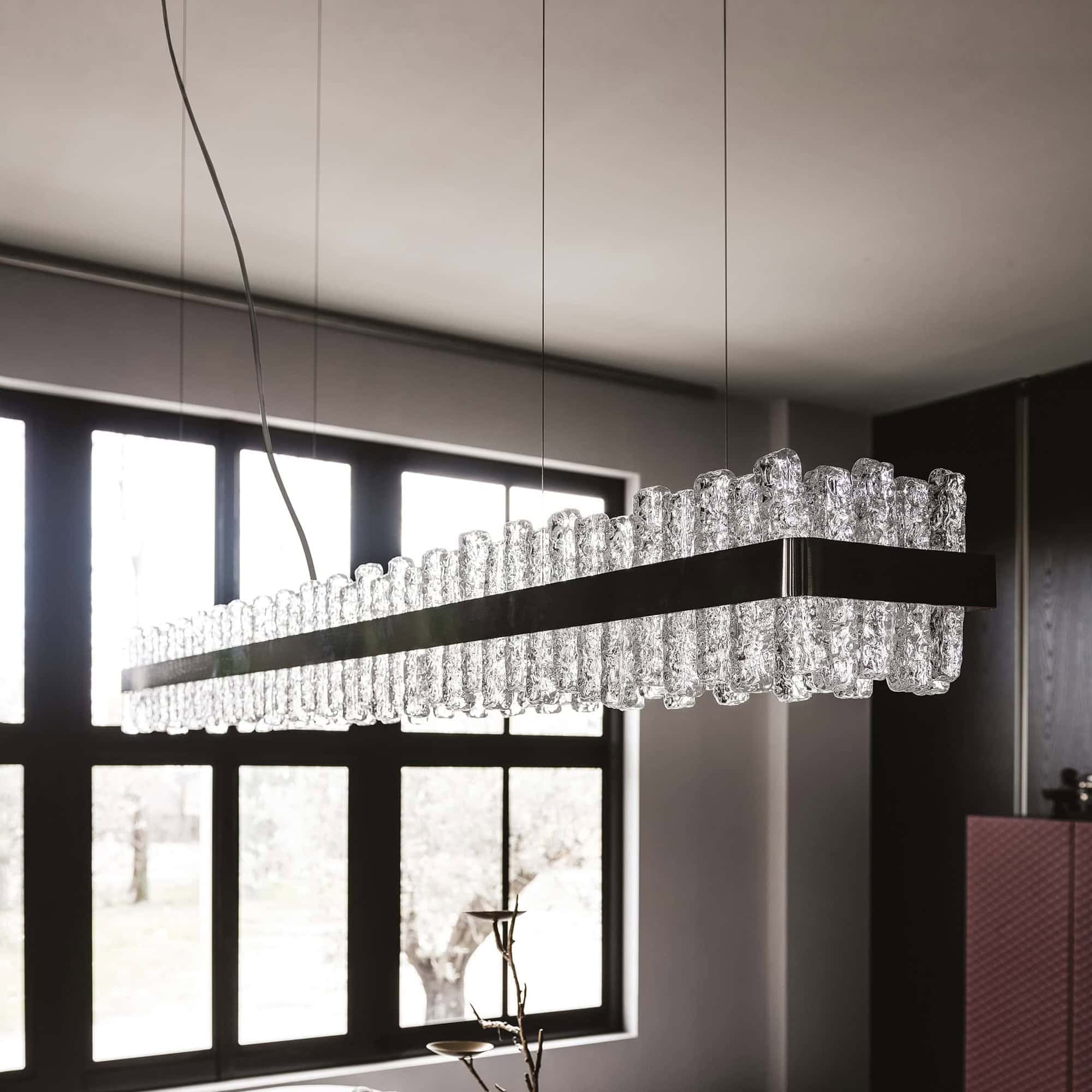 Handmade glass chandelier with multiple glass tubes, ideal for sophisticated lighting.
