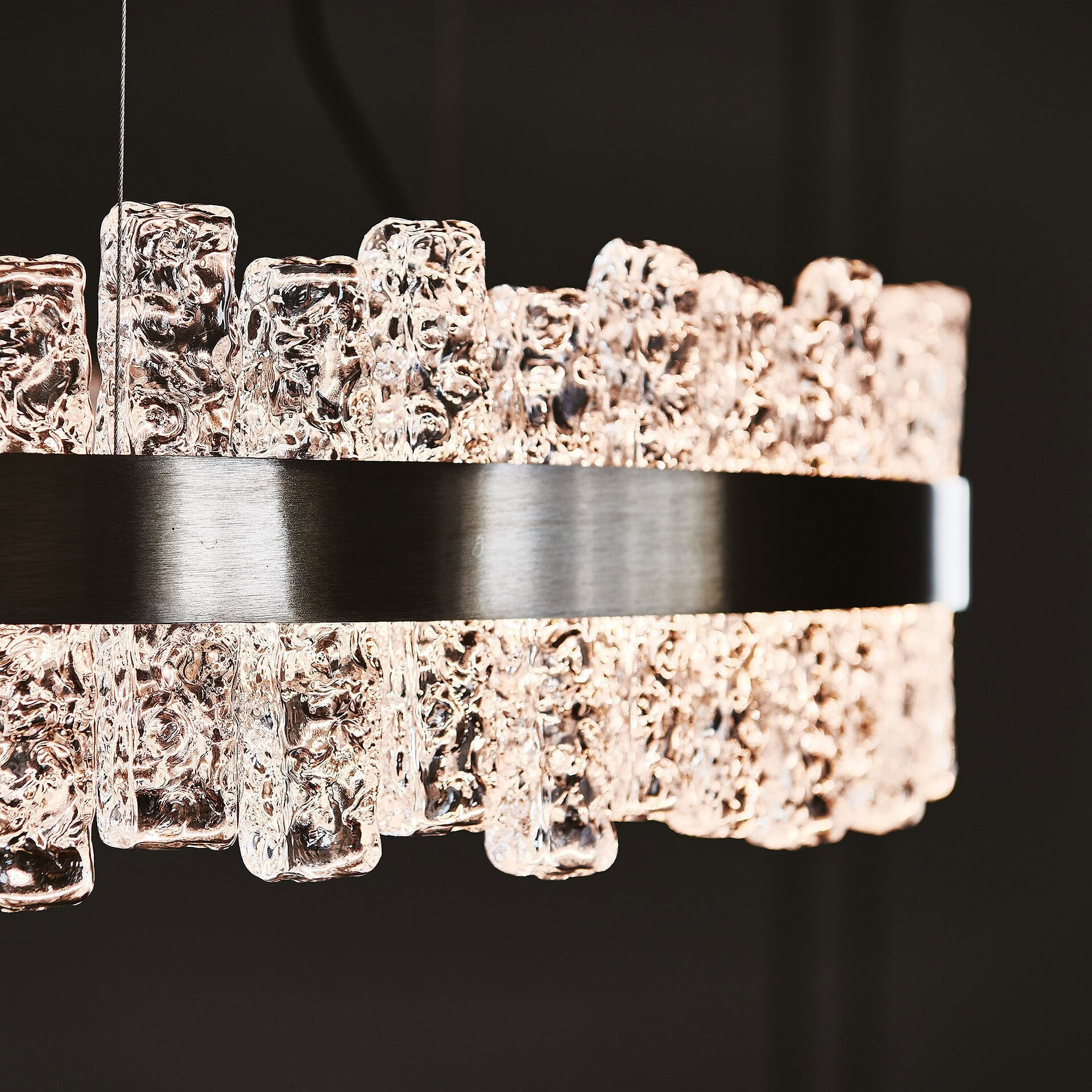Detailed view of Phoenix LED Handmade Glass Chandelier’s handcrafted glass elements illuminated.