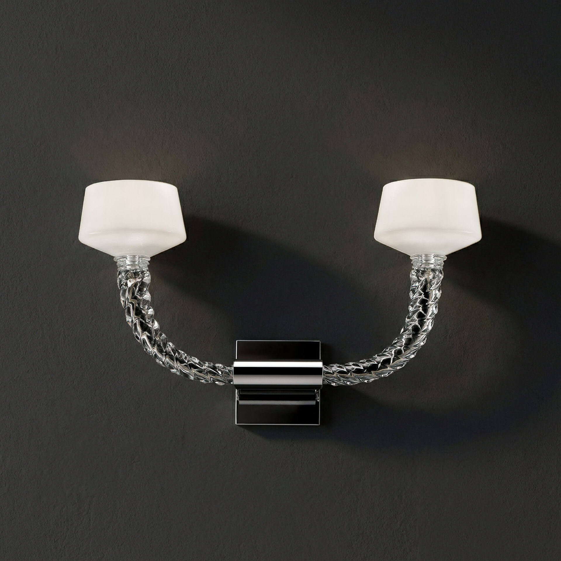 Mounted modern sconce with glass shades and chrome accents for elegant lighting.