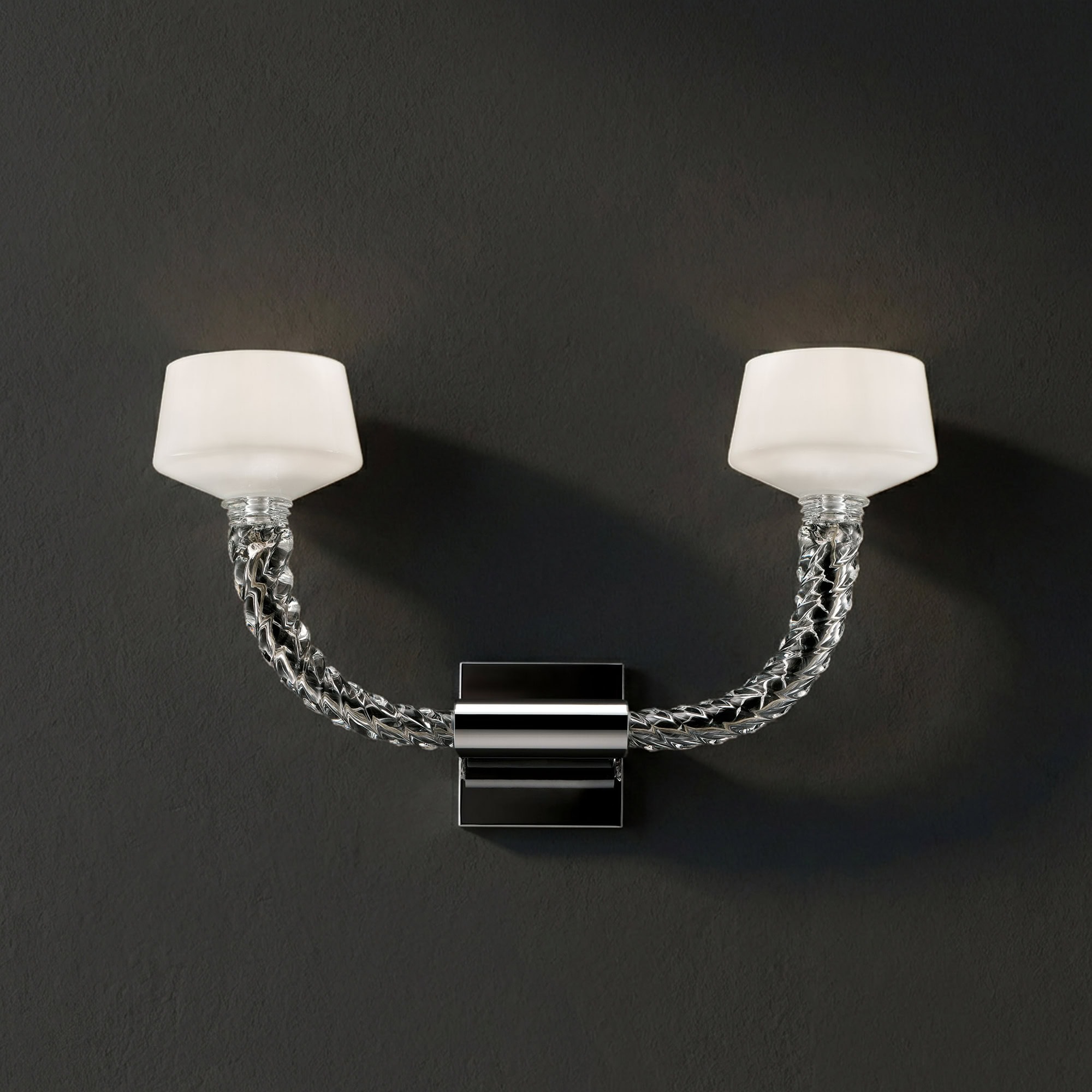 Mounted modern sconce with glass shades and chrome accents for elegant lighting.