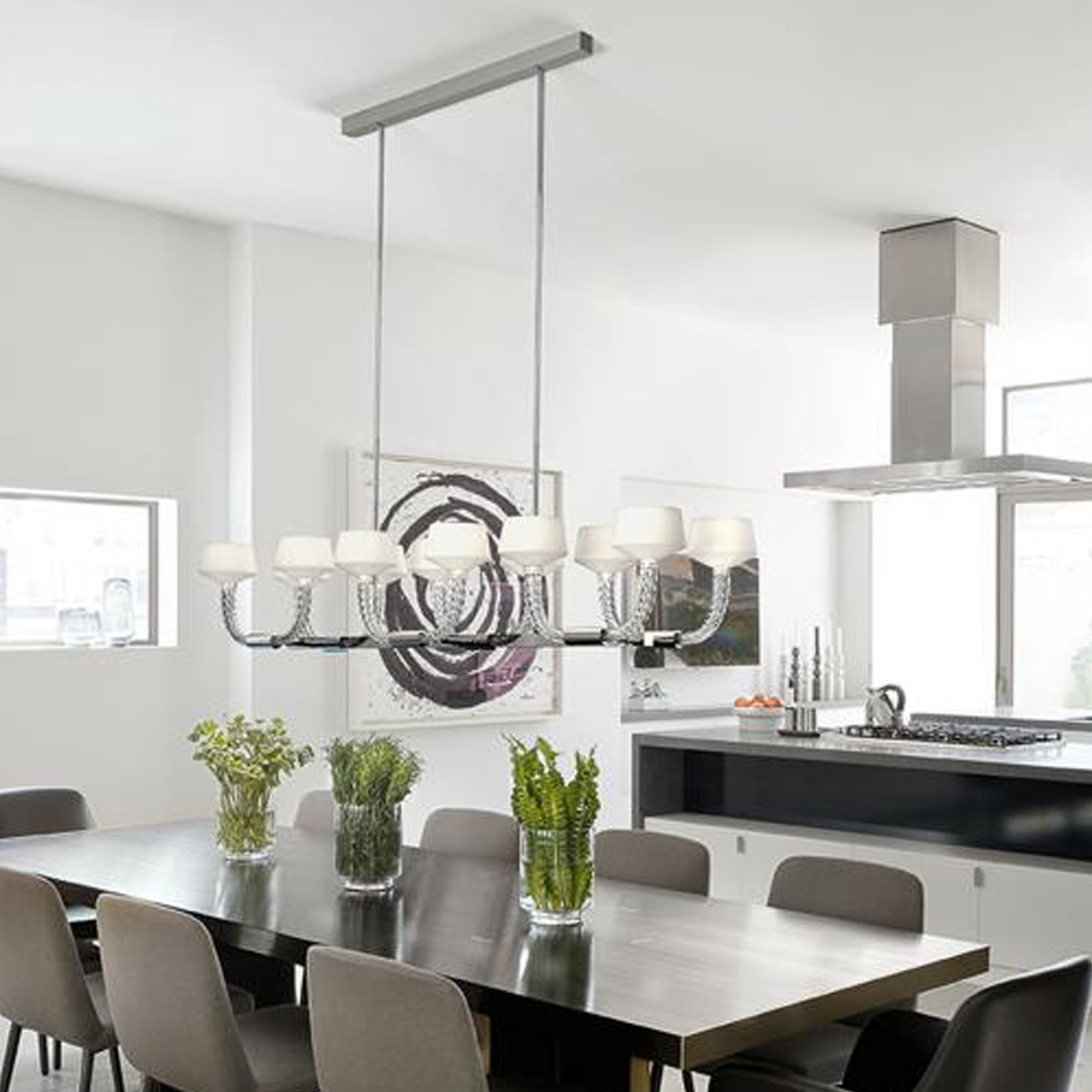 Twins chandelier by Barovier&Toso installed above a modern dining table, side angle.