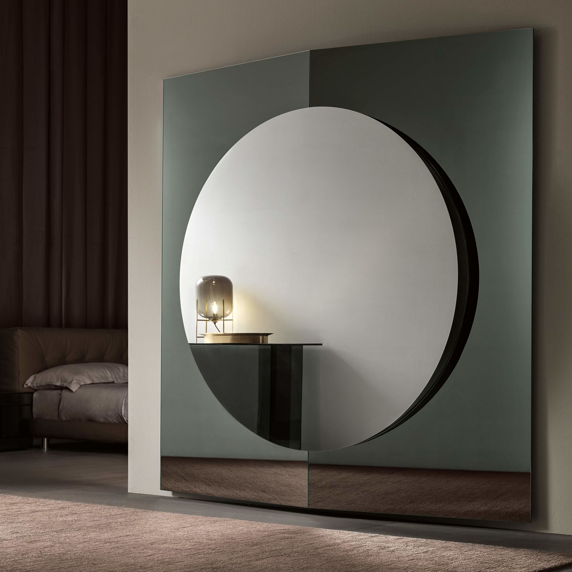 Central modern design mirror with round central part and inclined side  panels