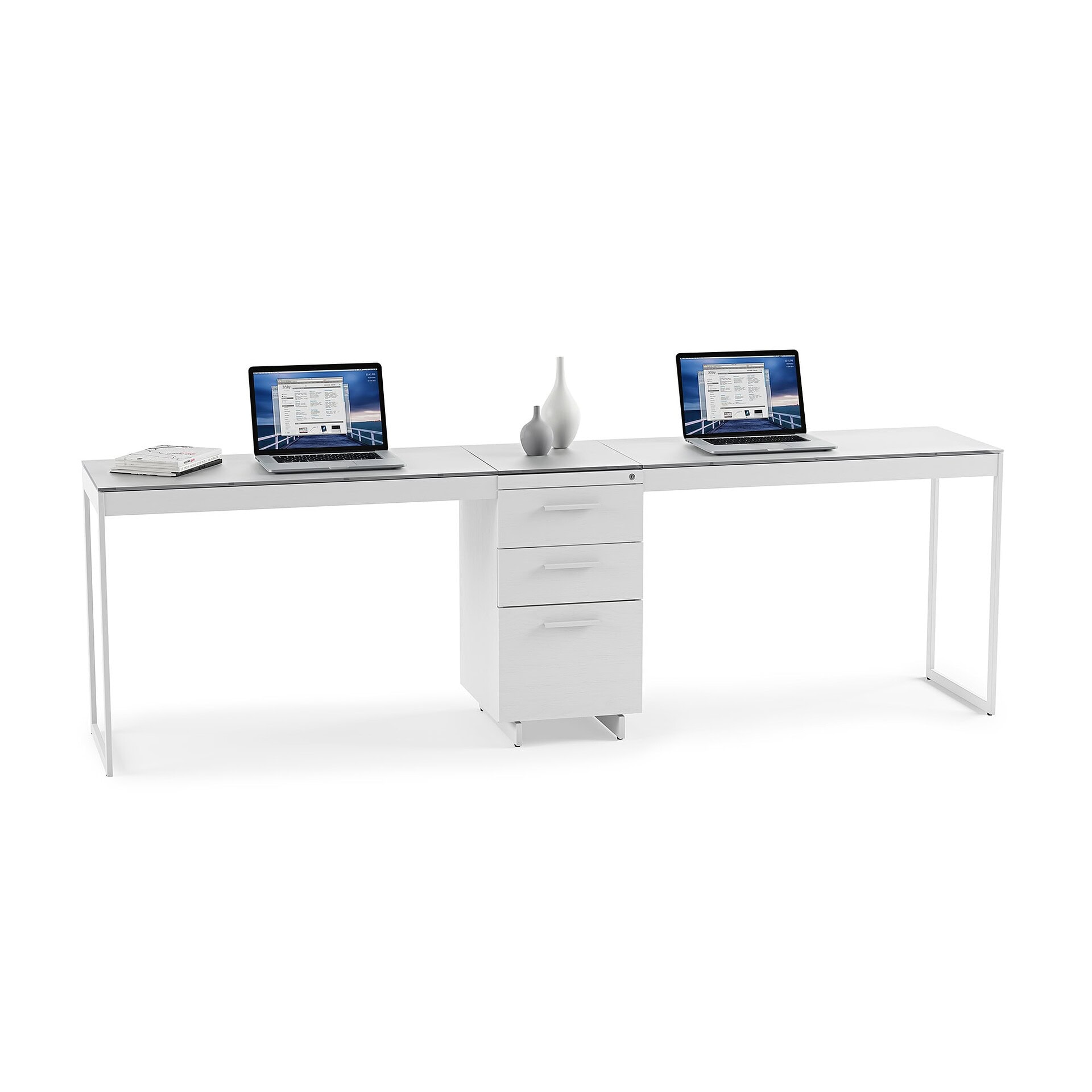 White modern office desk with drawer cabinet and two laptops for workspace organization.