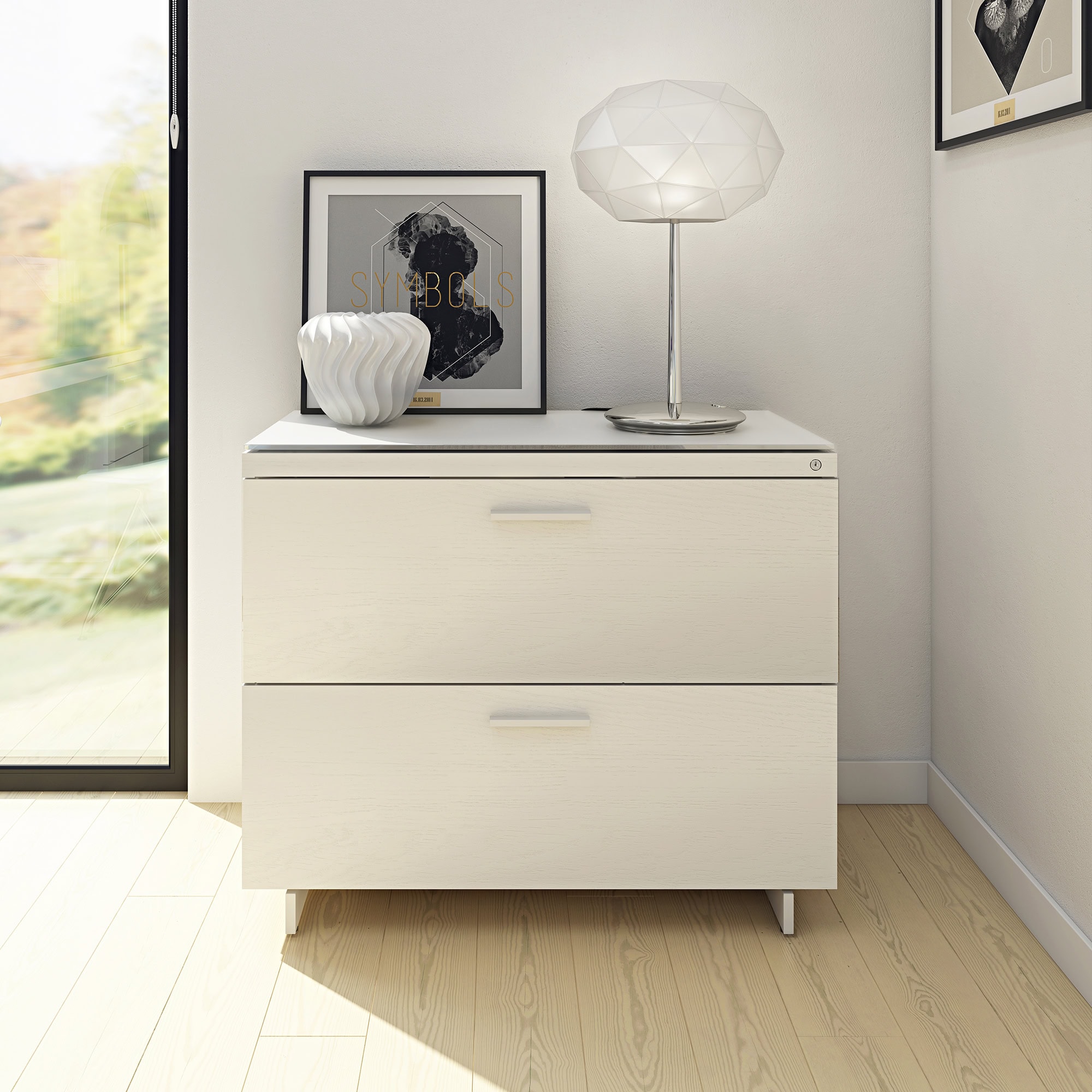 Modern white dresser with decorative lamps and artwork, stylish furniture from Sklar Furnishings.