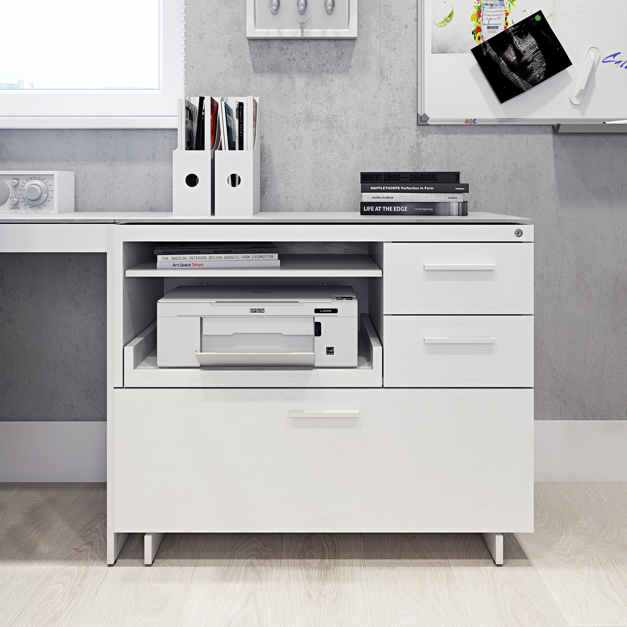 Modern white office desk with printer, books, and storage drawers, ideal for home or corporate workspace.