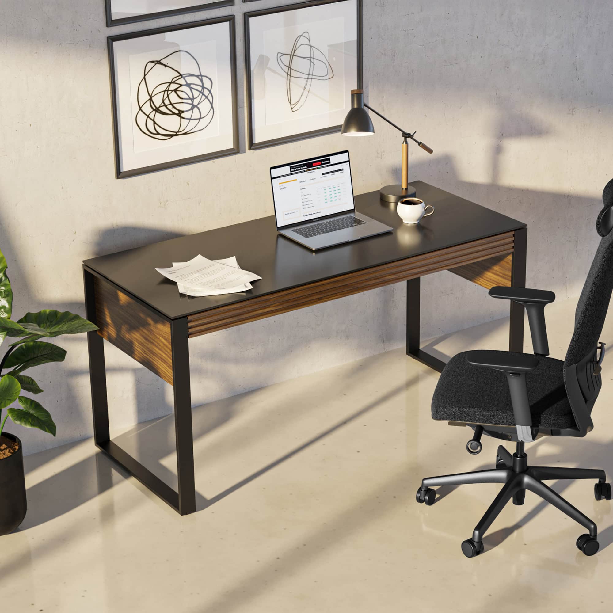 Sleek modern home office desk with black top and wooden accents, paired with ergonomic office chair.