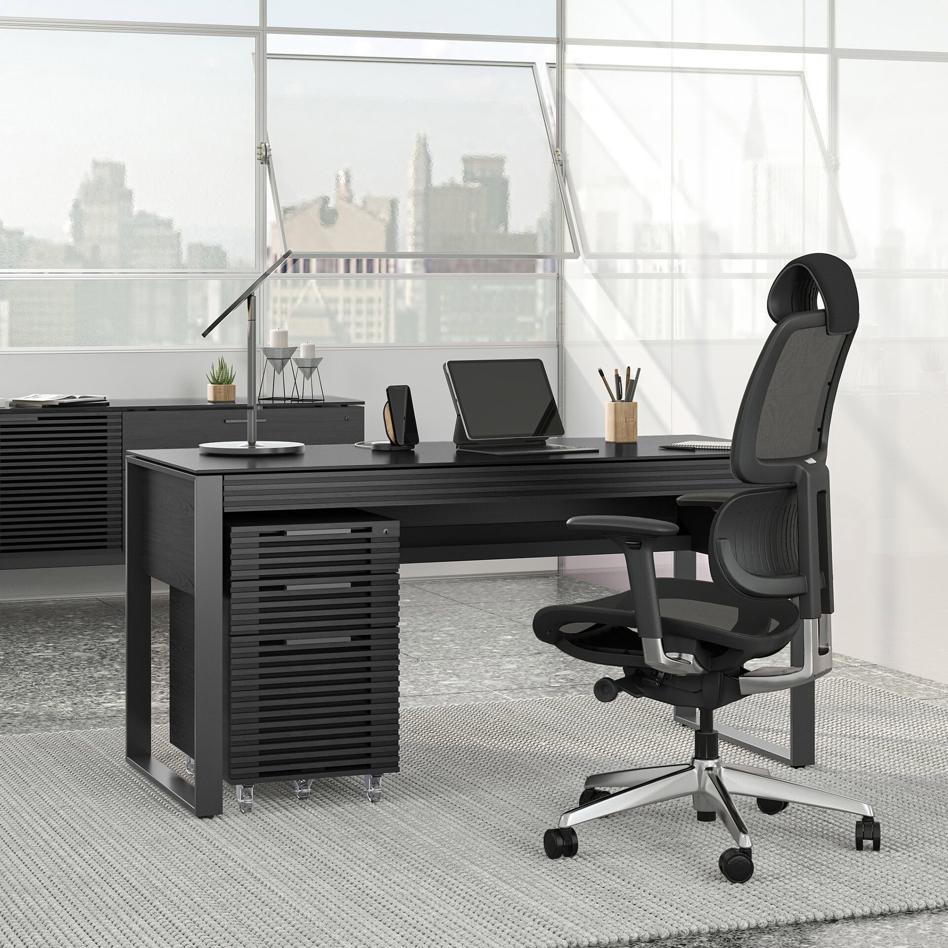1. Modern black office desk with ergonomic chair and sleek workspace accessories.