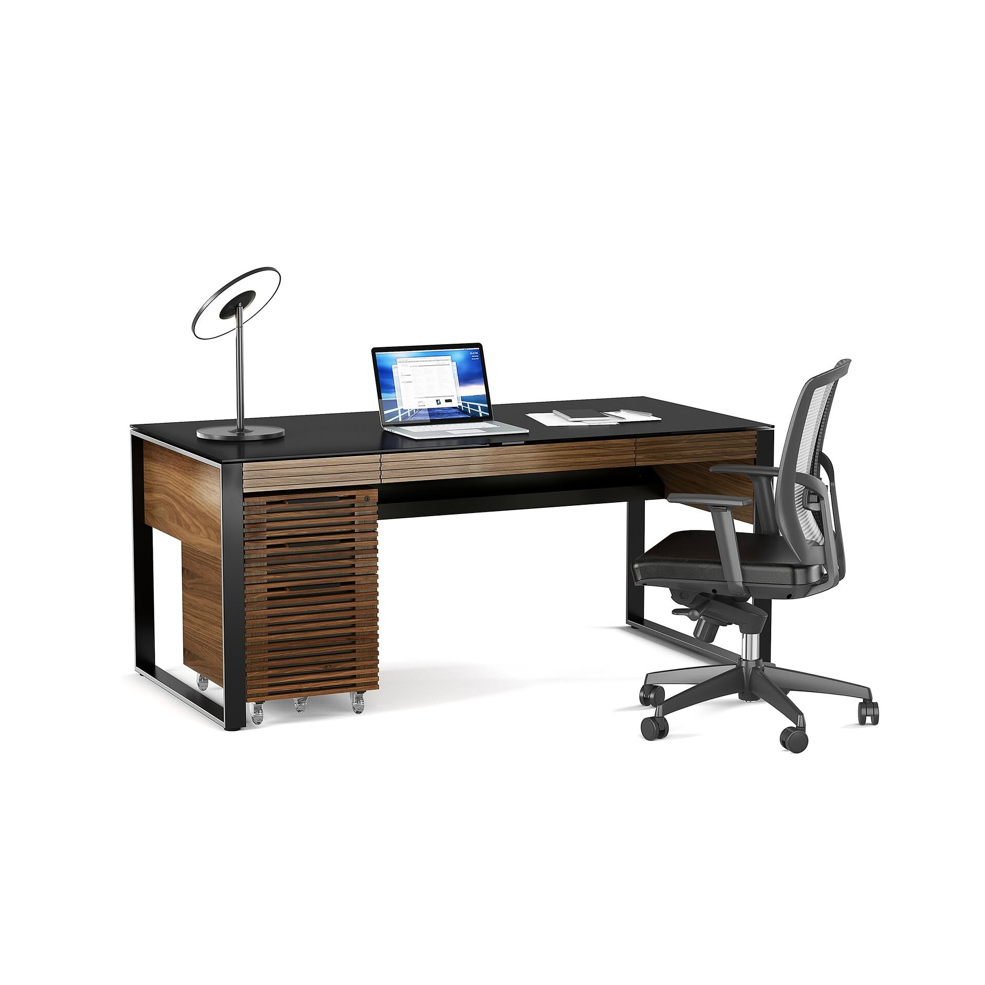 Modern office desk with wood and black accents, ergonomic chair, and sleek workspace setup.