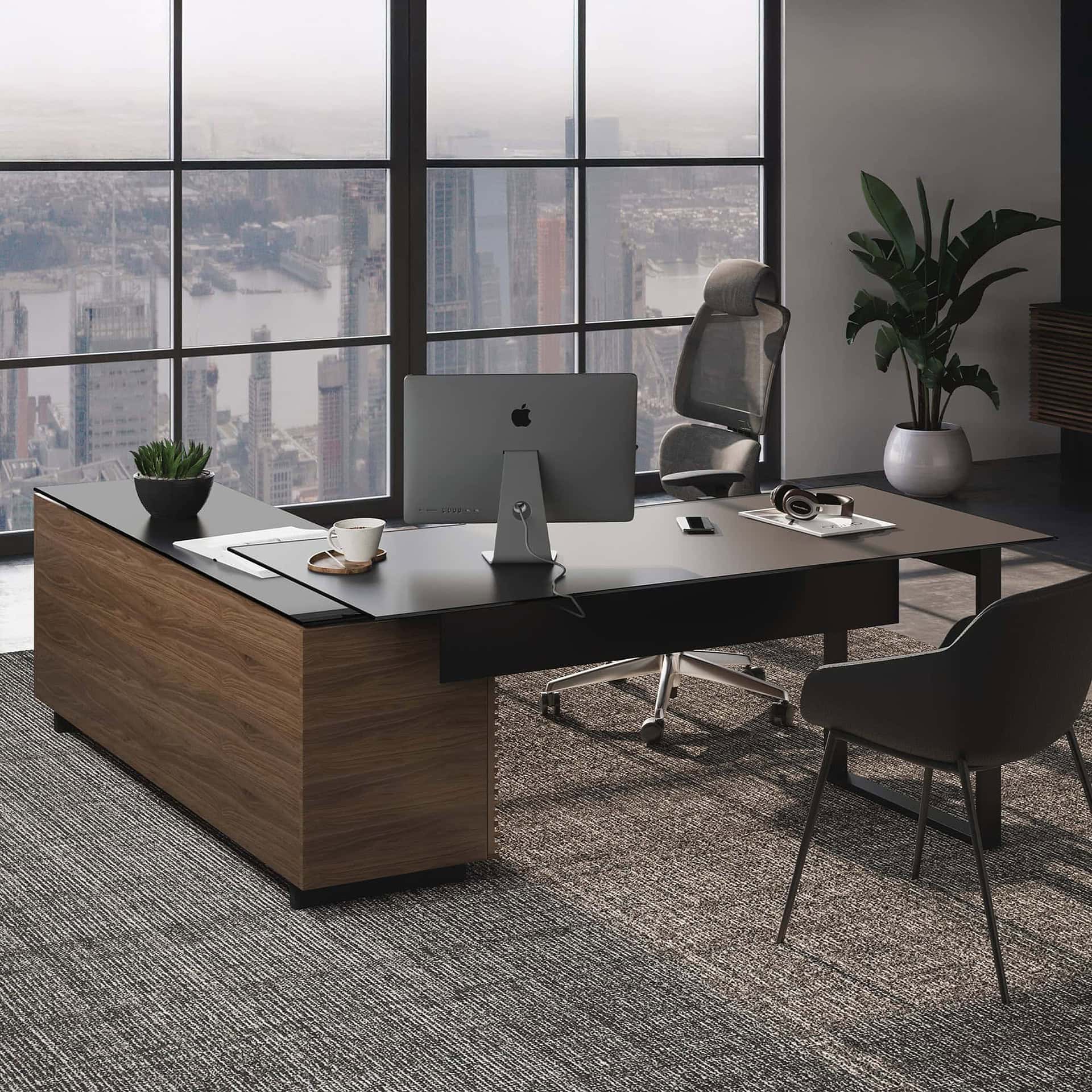 1. Modern executive office desk with wood and black finishes in high-rise setting.