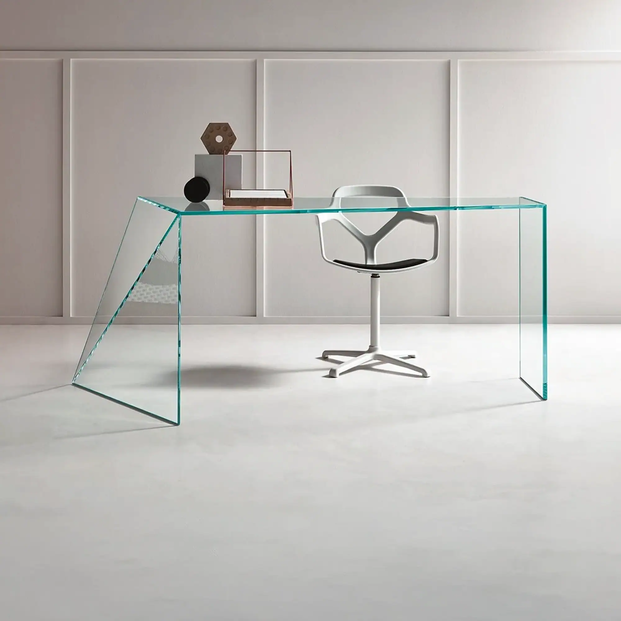 Sklar Furnishings glass desk with modern design in minimalist room.