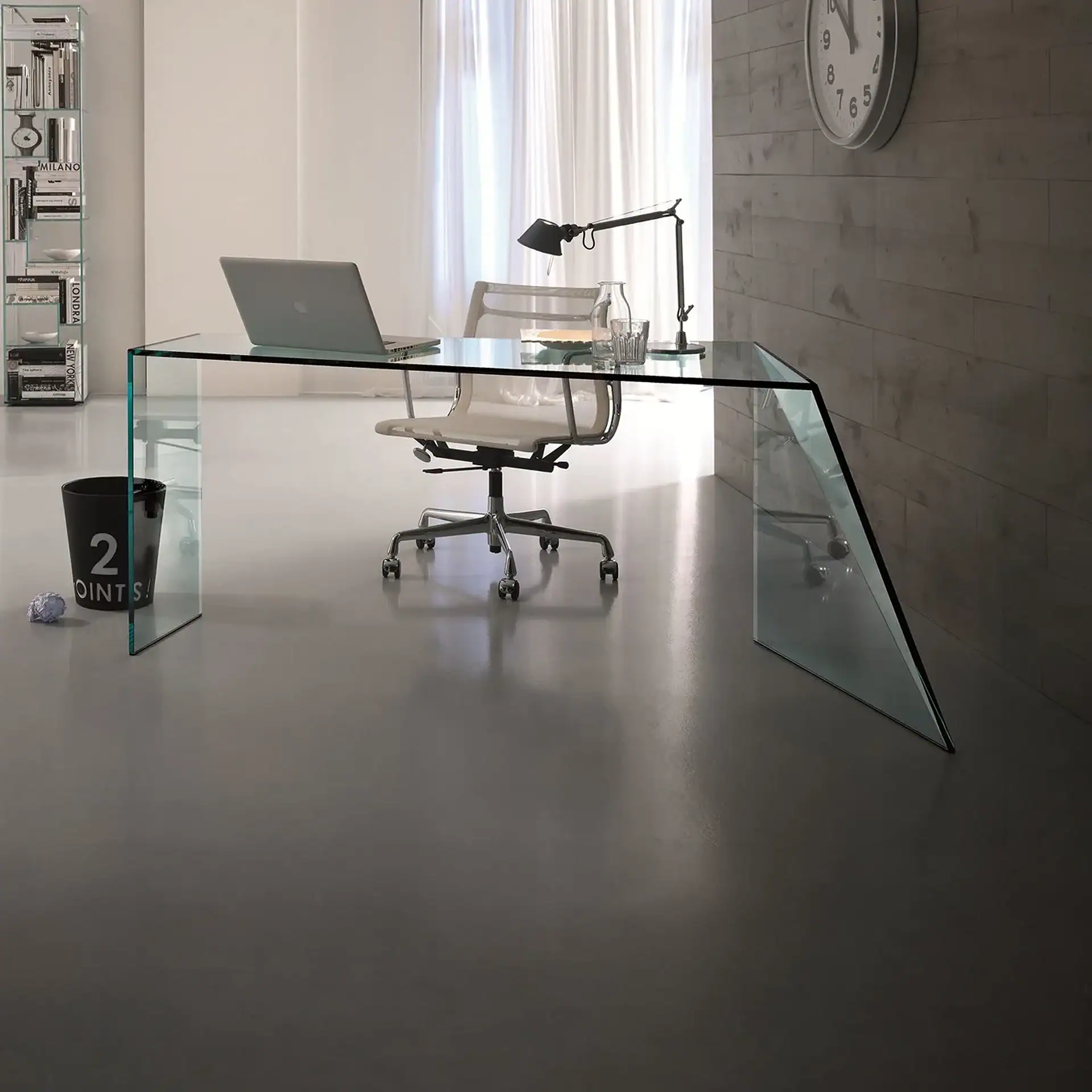 Sklar Furnishings glass desk with modern office setup and chair.