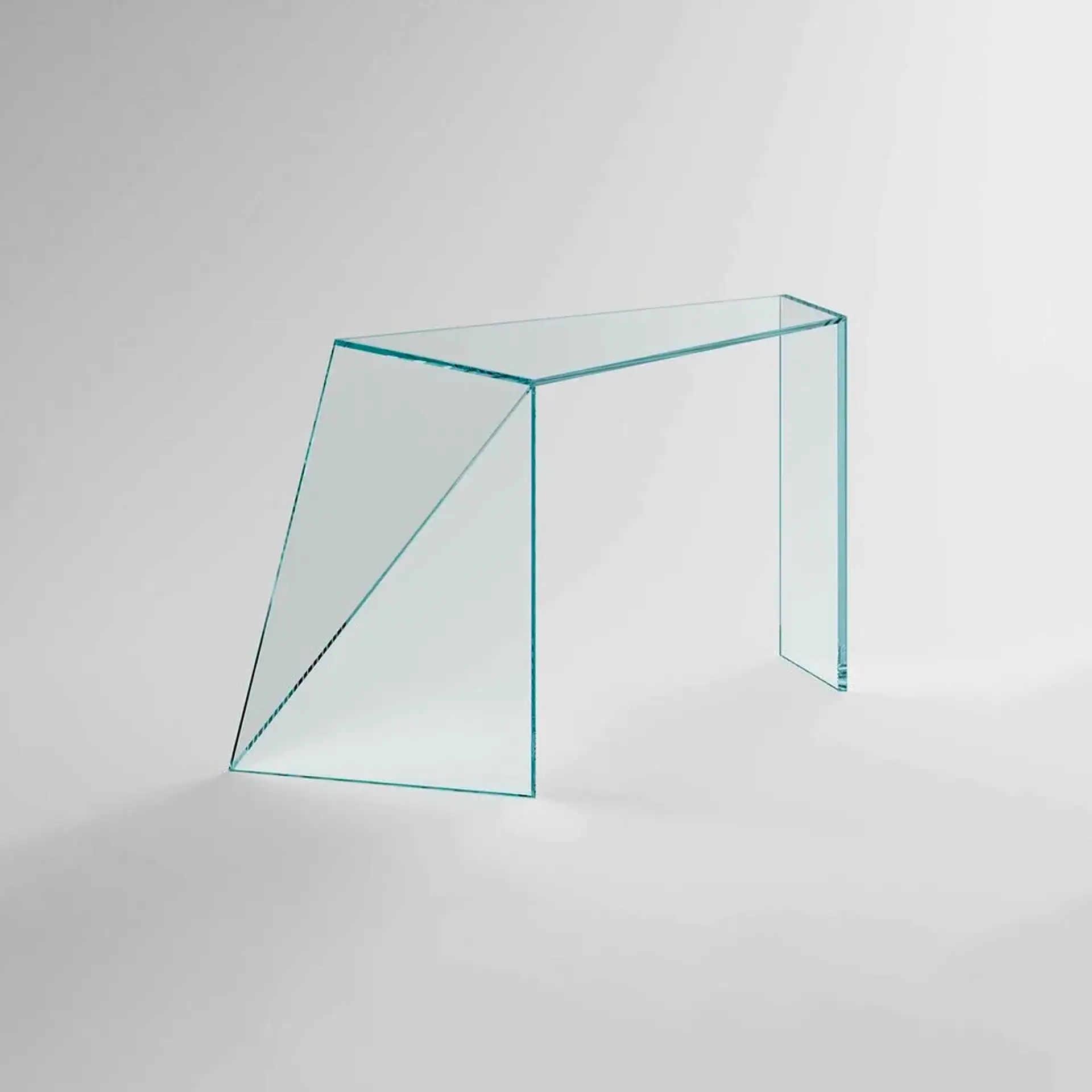 Sklar Furnishings glass desk with geometric design on a plain background.