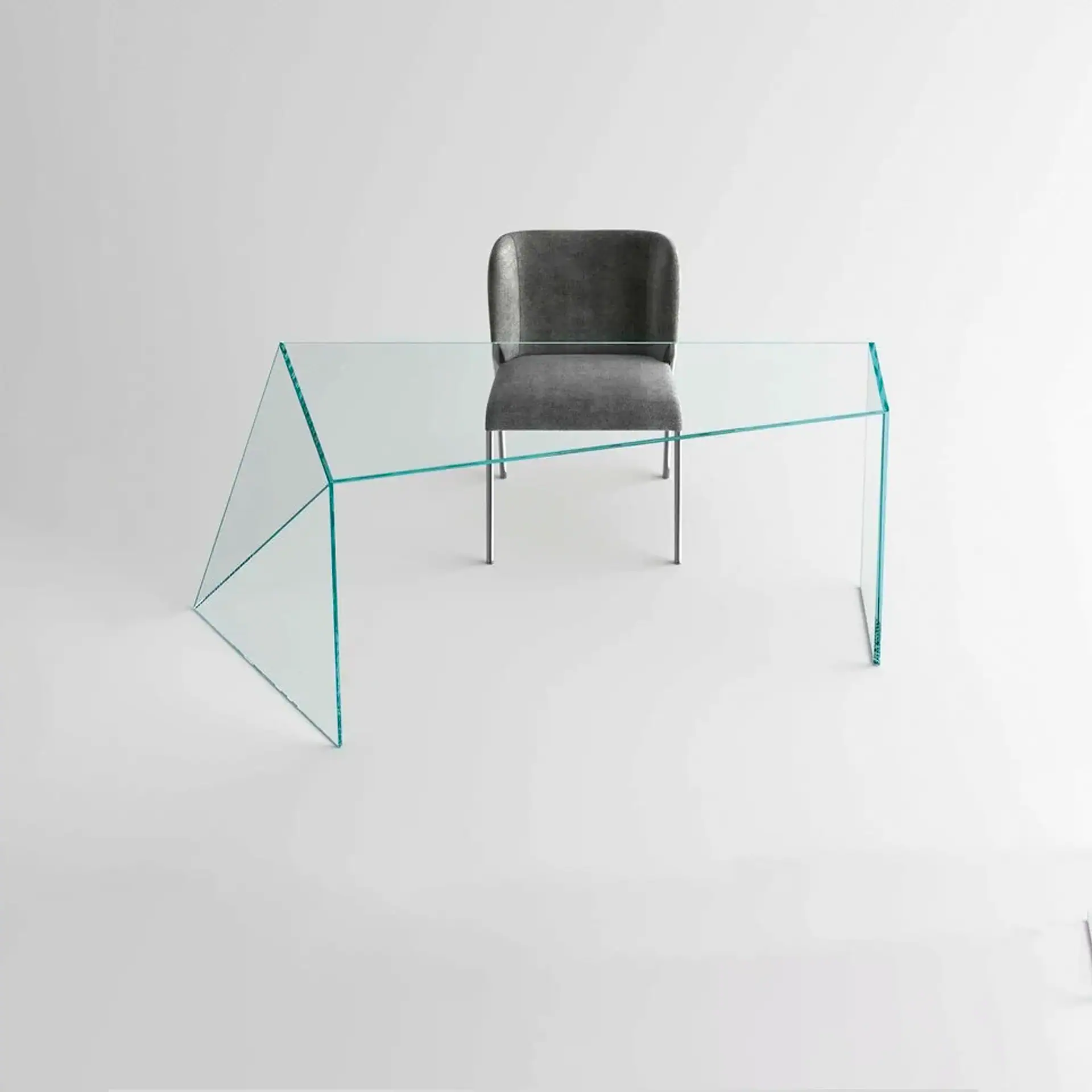 Sklar Furnishings glass desk with black chair in a minimal setting.
