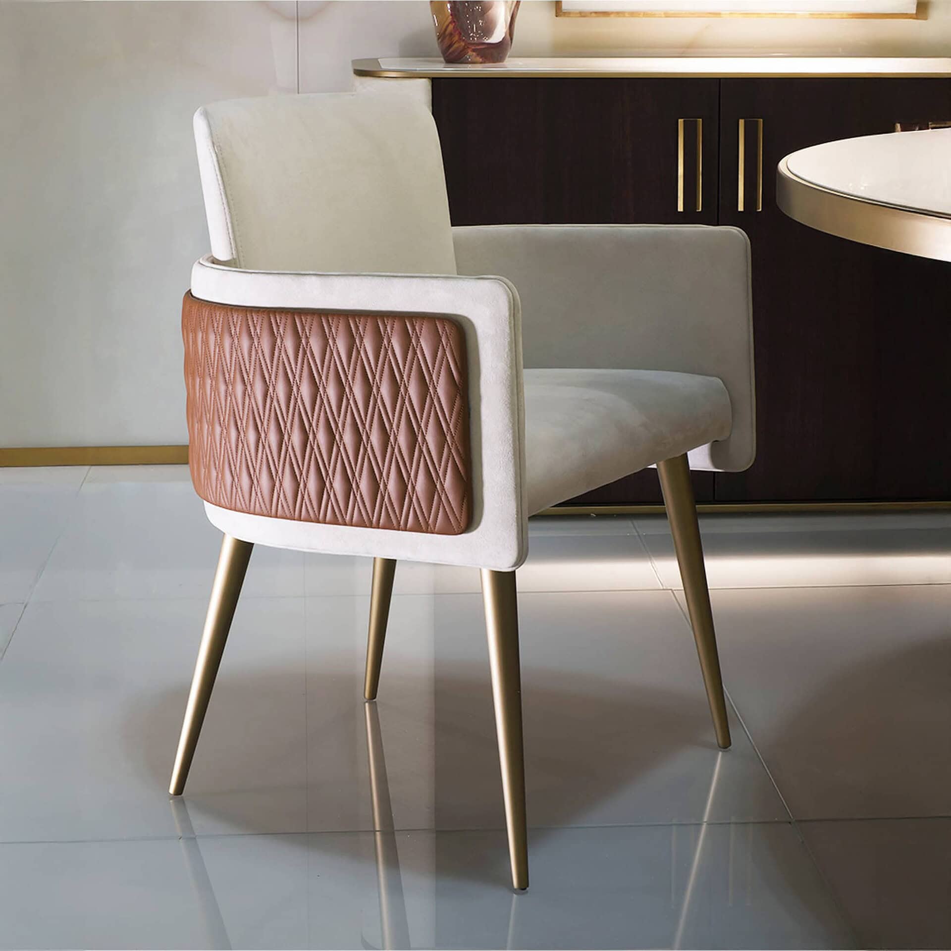 Elegant modern dining chair with retro design and gold metal legs, stylish for contemporary homes.
