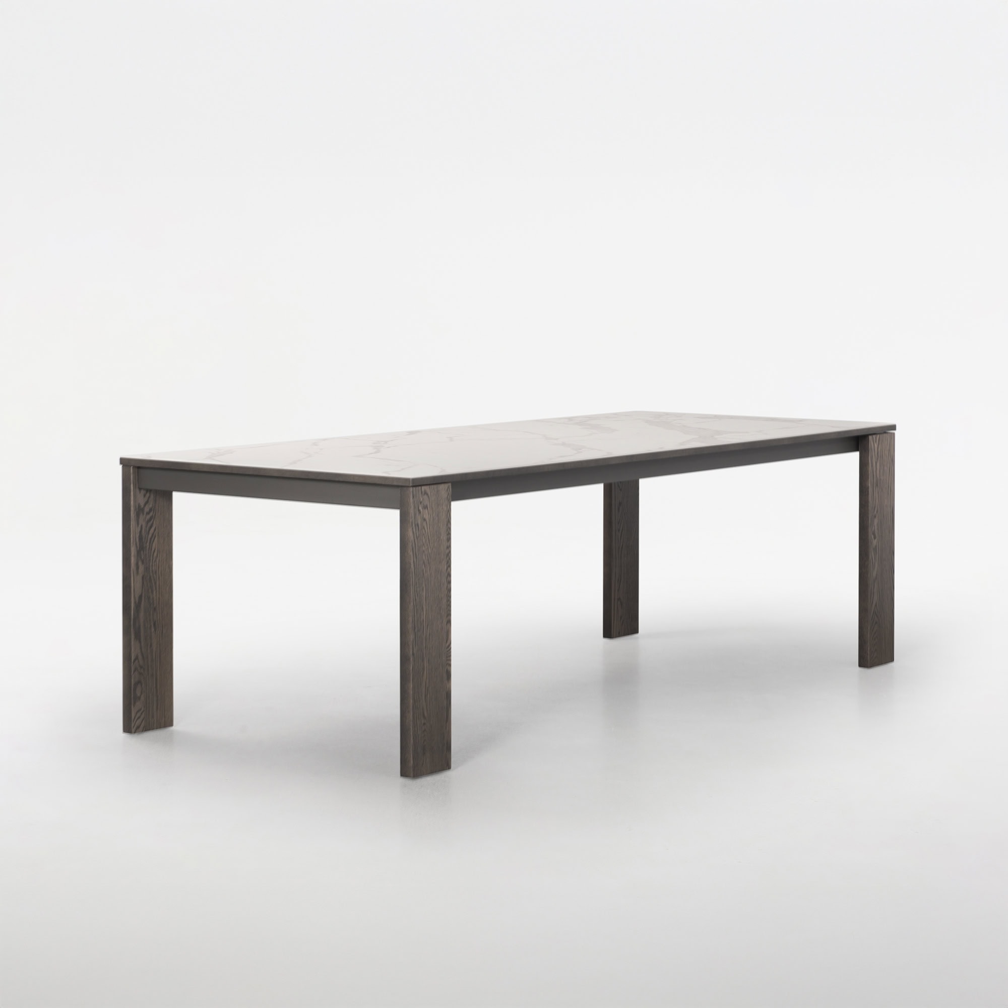 Trica Empire Extendable Dining Table, side angle view with wood base and porcelain top