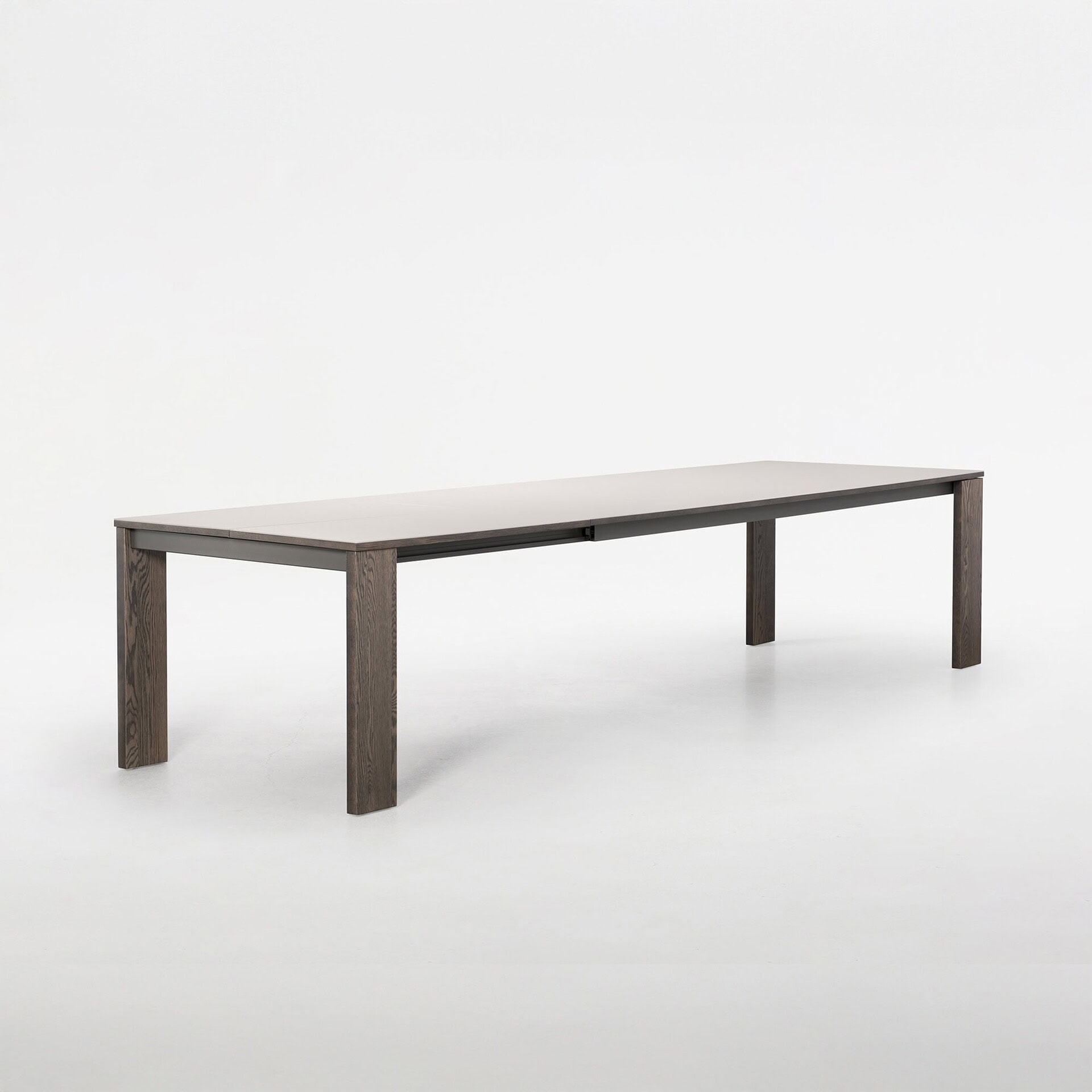 Trica Empire Dining Table extended with butterfly leaf, angled product shot on white background