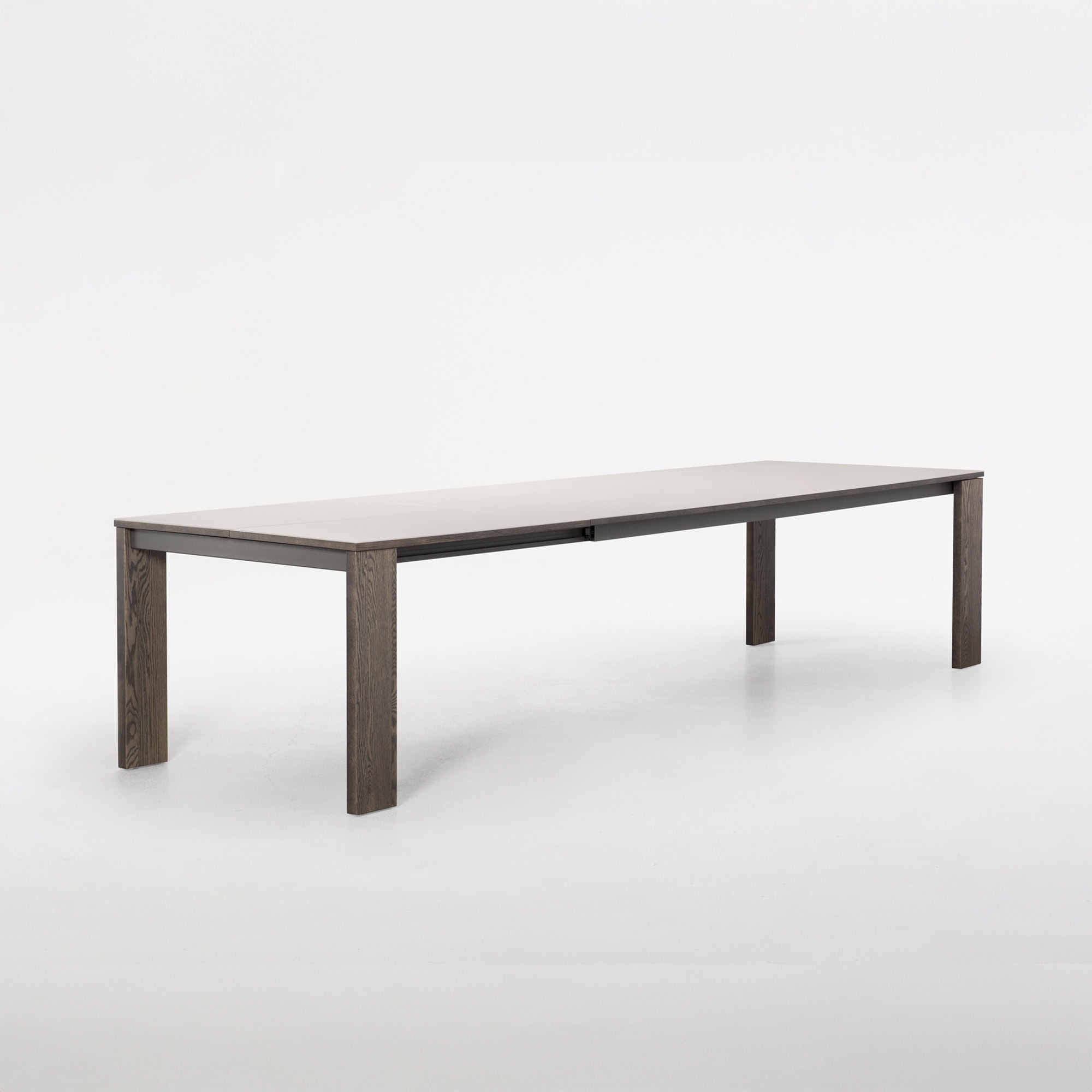 Trica Empire Dining Table extended with butterfly leaf, angled product shot on white background