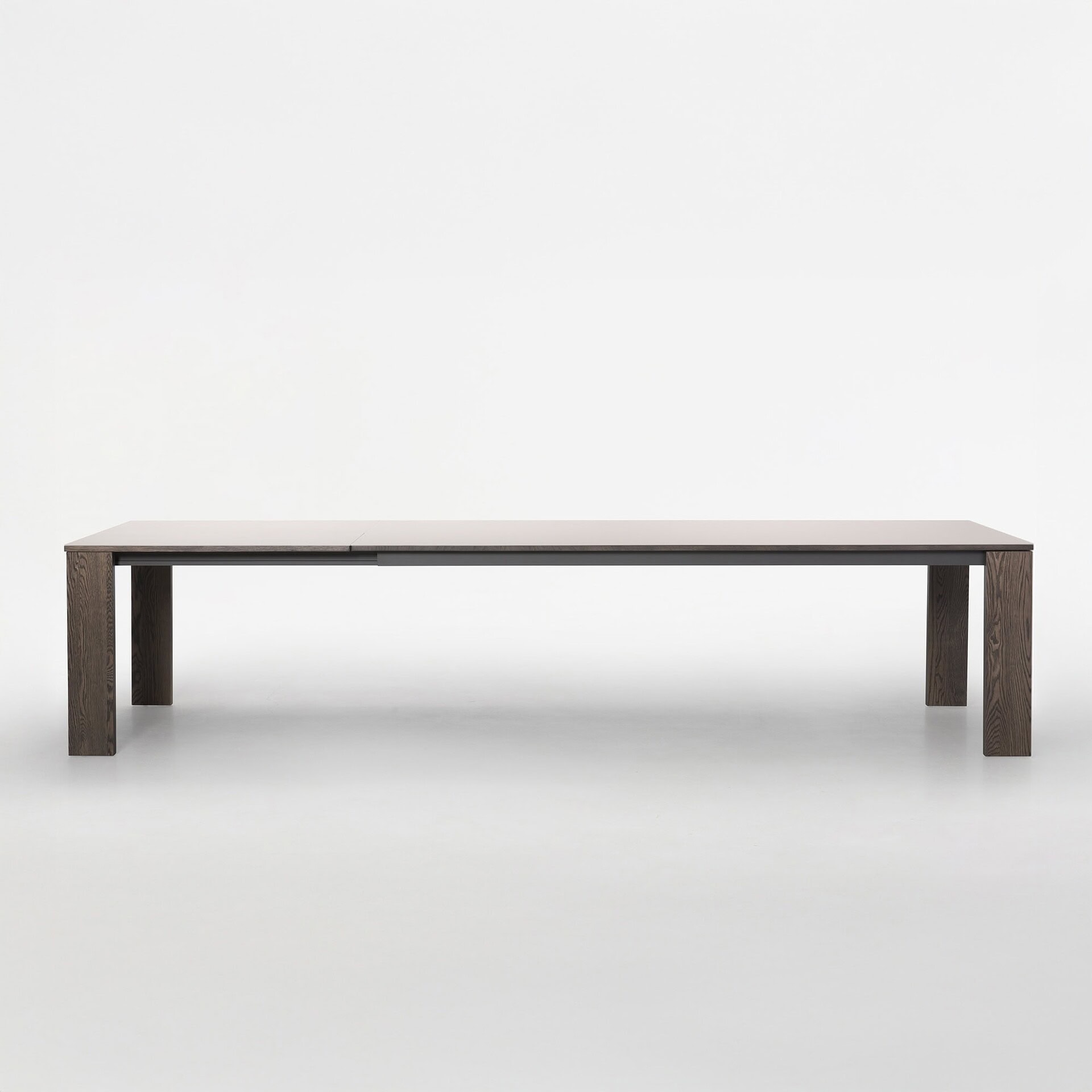 Extended Trica Empire Dining Table with butterfly leaf fully open, front view on white background