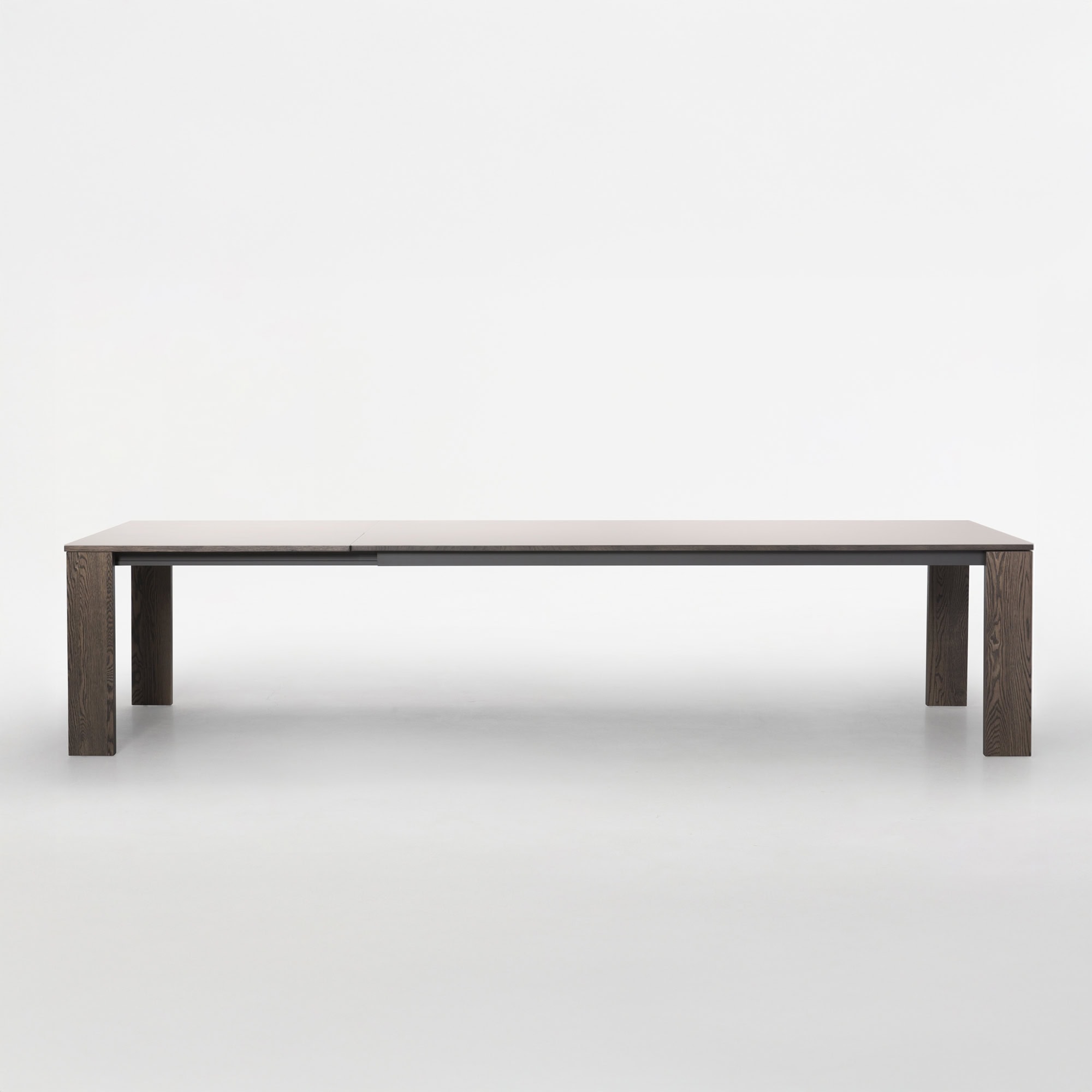 Extended Trica Empire Dining Table with butterfly leaf fully open, front view on white background