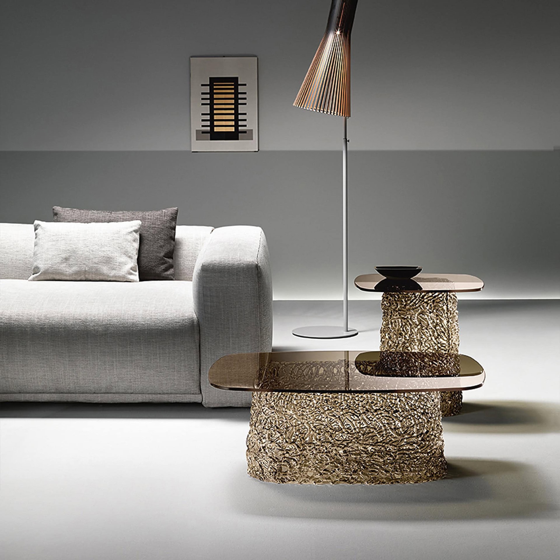 Pair of Macramè Coffee Tables in bronze glass finish shown in a contemporary interior