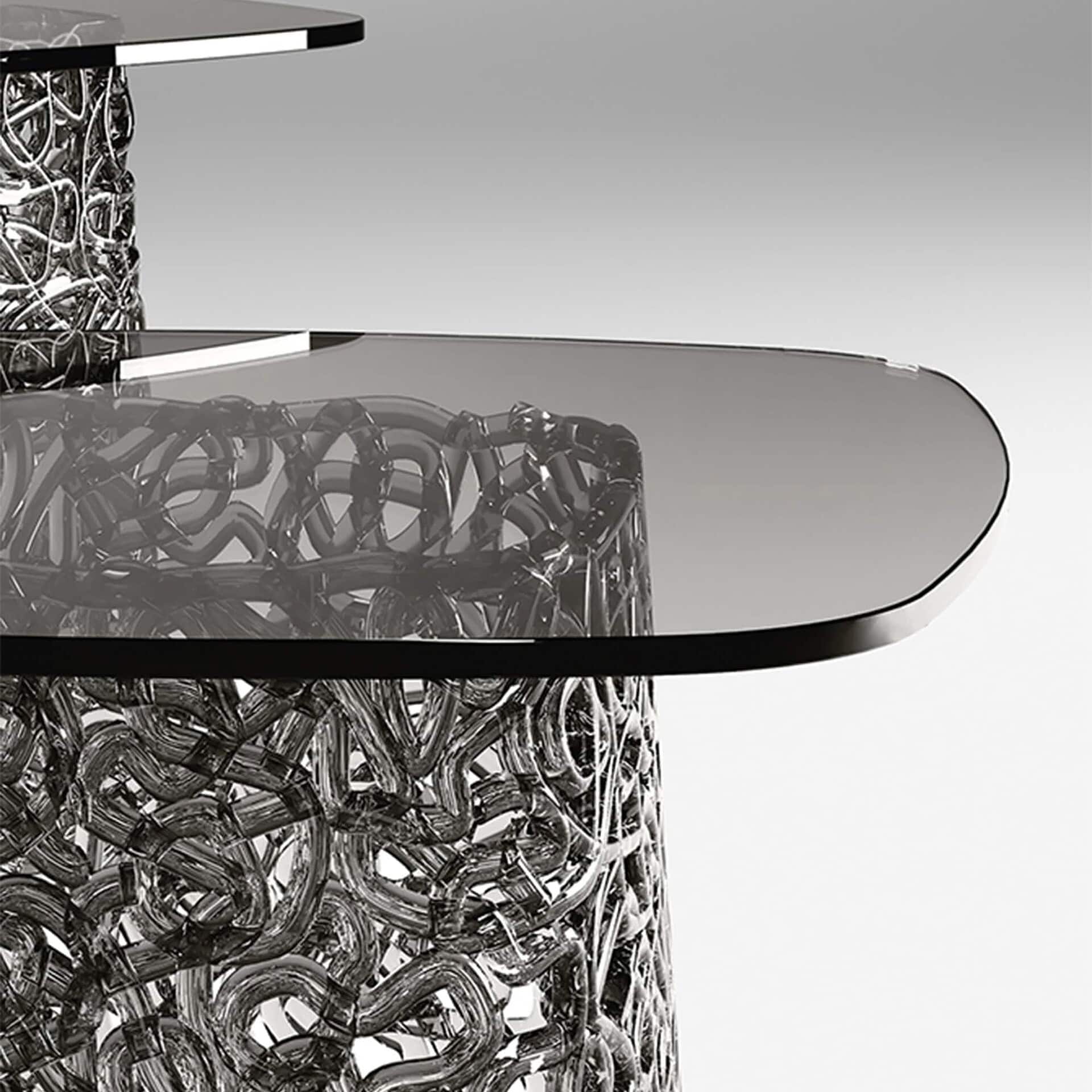 Detail view of Macramè Coffee Table glass top and woven glass base texture