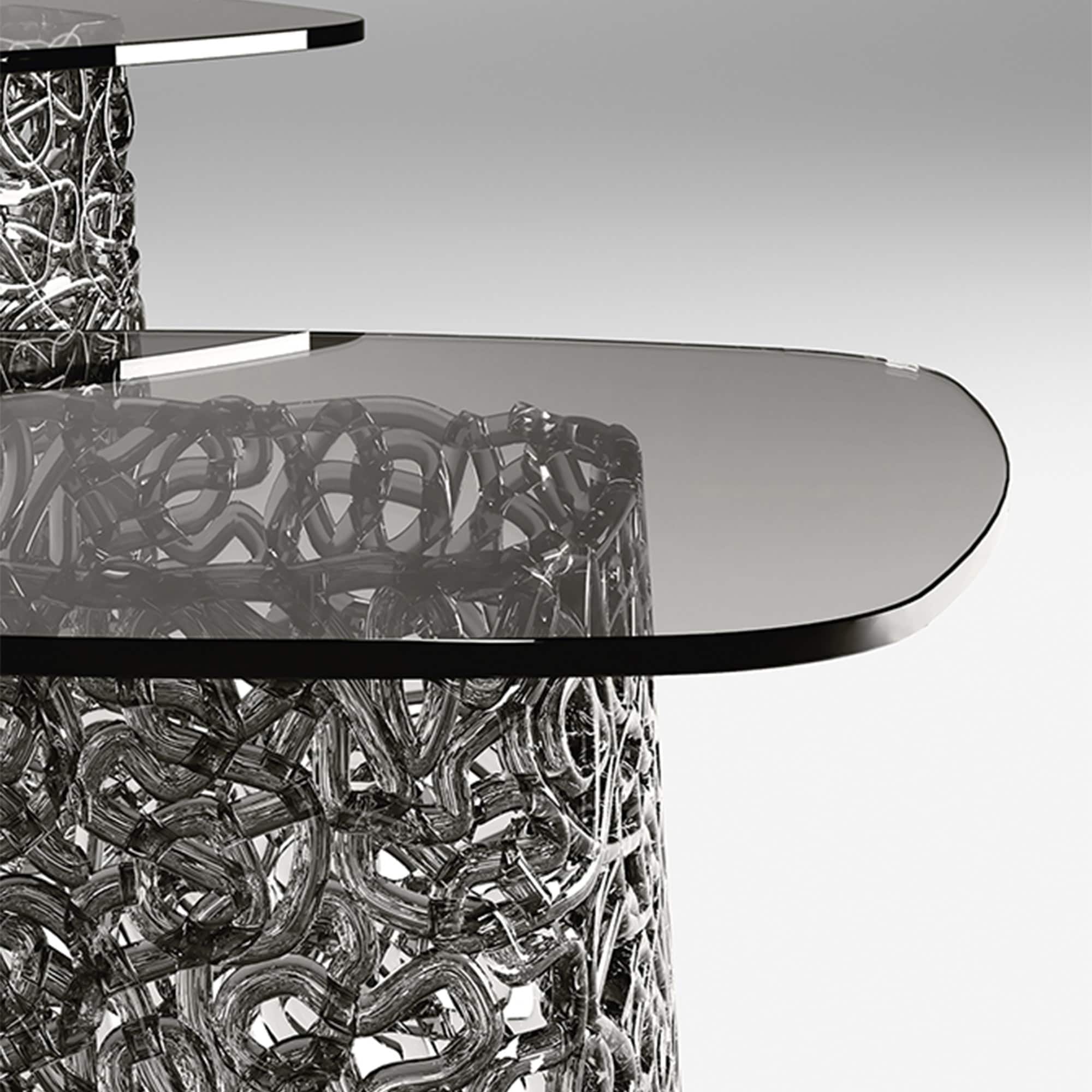 Detail view of Macramè Coffee Table glass top and woven glass base texture