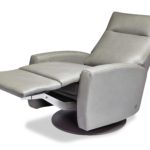 Luxurious modern gray leather recliner chair with adjustable footrest.