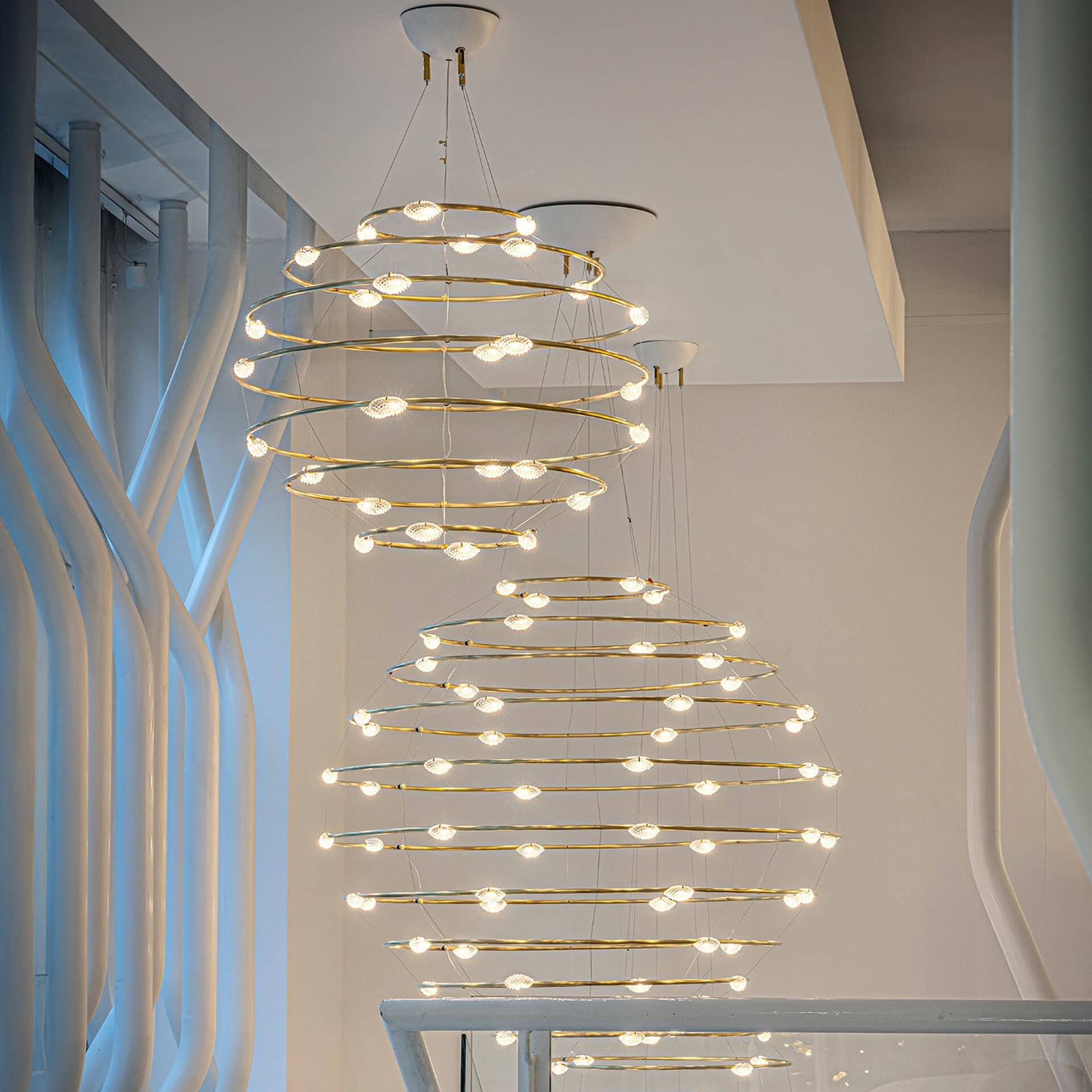Contemporary spiral chandelier with LED lights for stylish interior lighting.