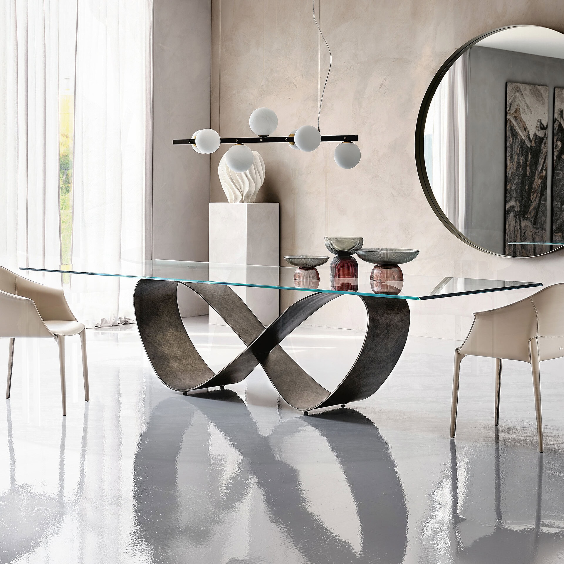 Elegant butterfly-shaped sculptural dining table with glass top and modern design.