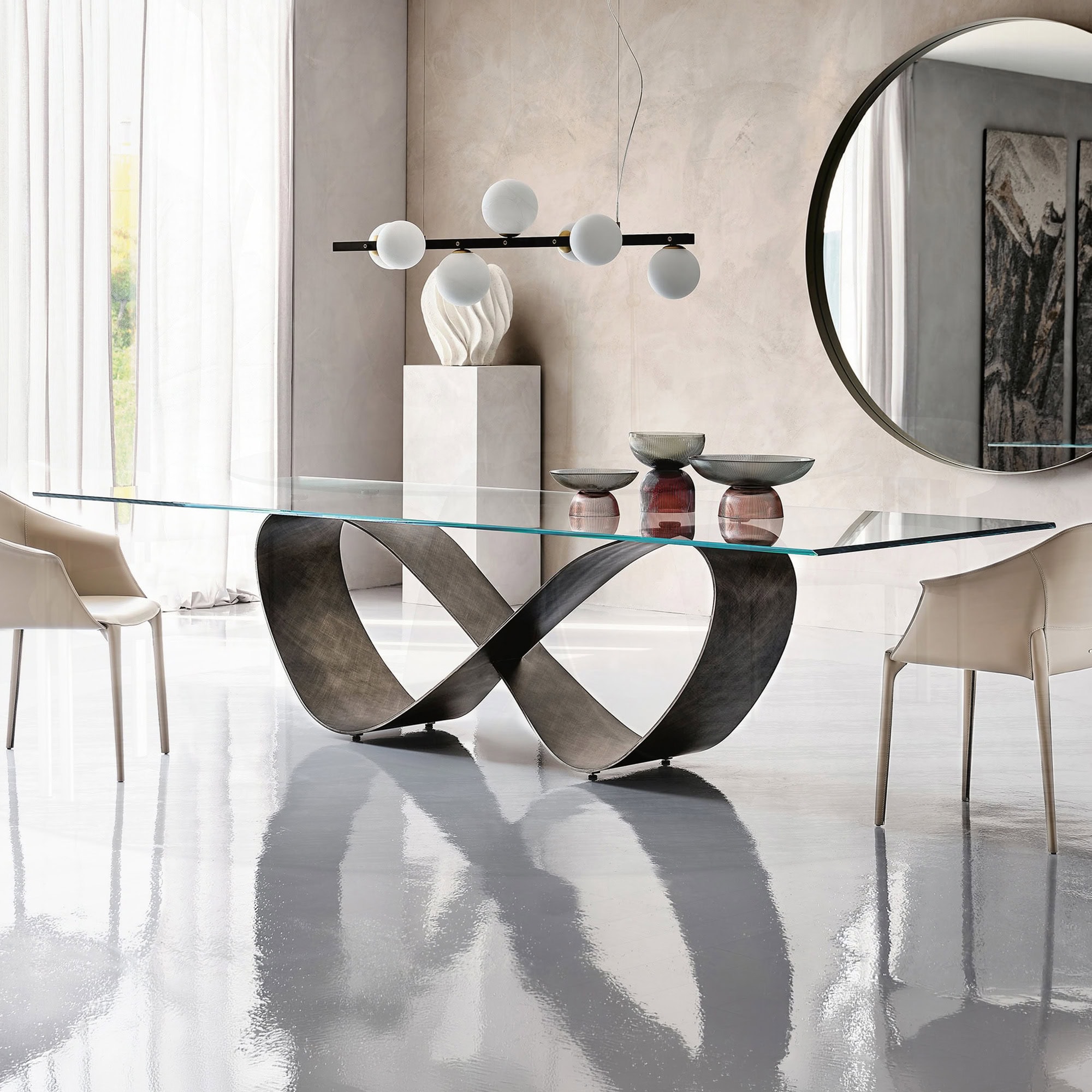 Elegant butterfly-shaped sculptural dining table with glass top and modern design.