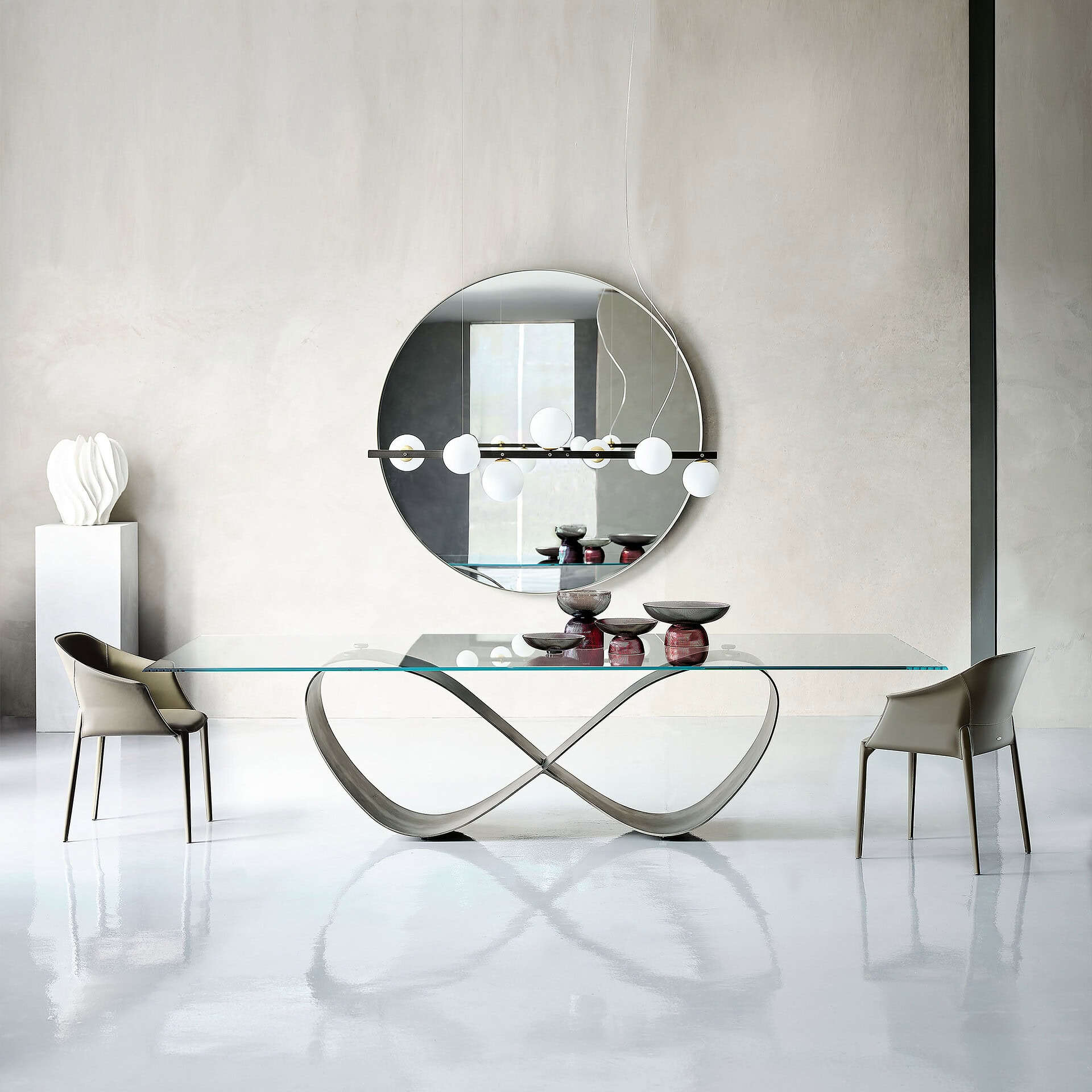 Elegant butterfly-shaped sculptural dining table with glass top and modern design.