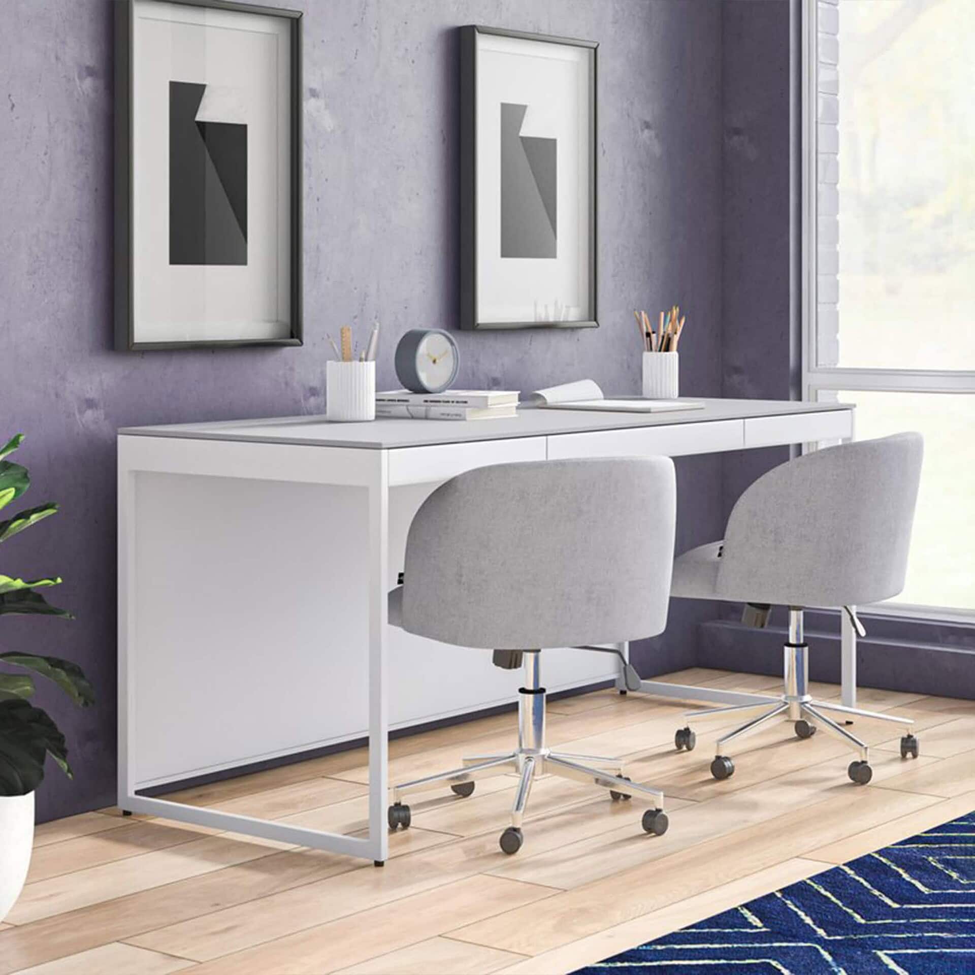Modern white desk with two gray office chairs in a contemporary workspace setting.