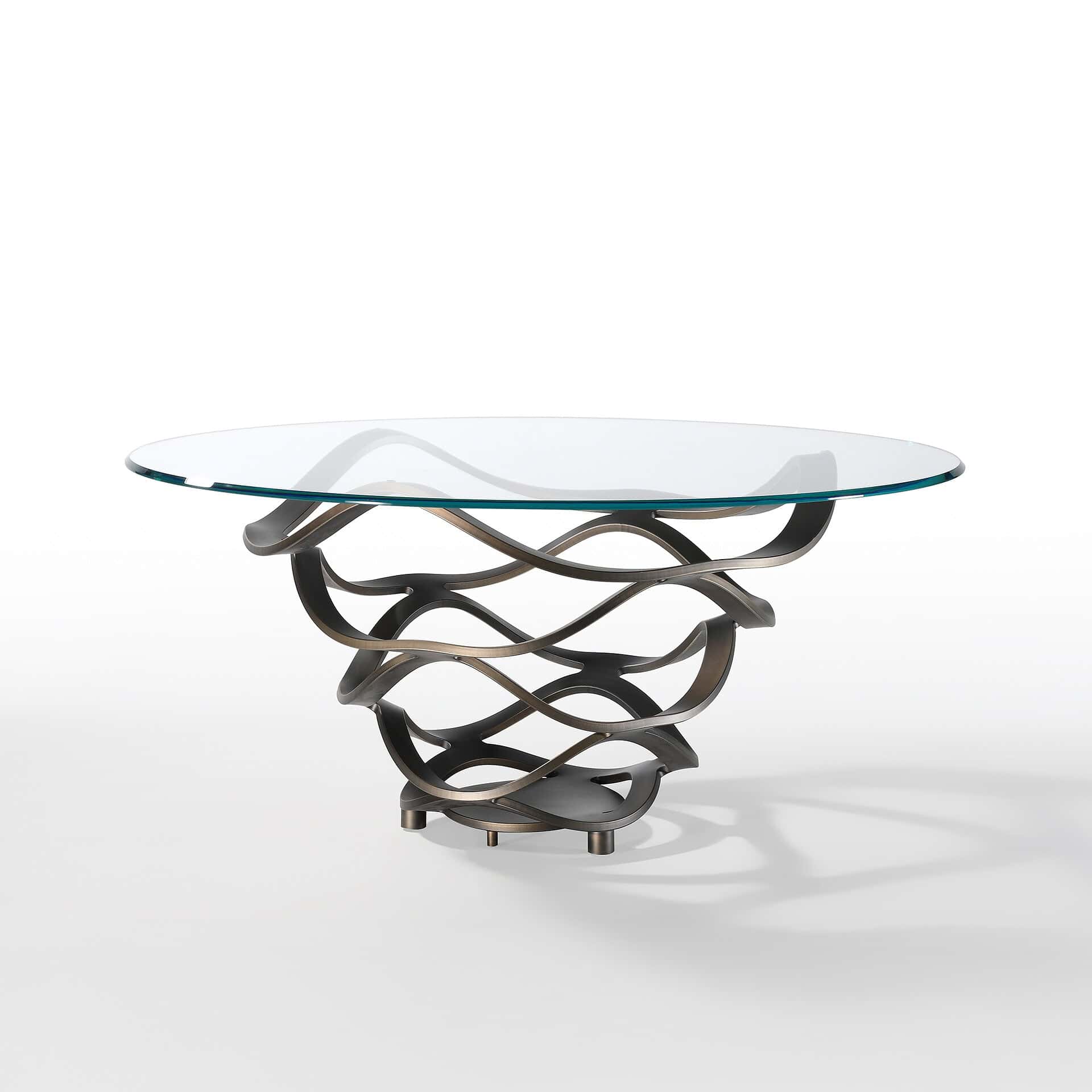 Modern glass dining table with artistic metal base for stylish dining spaces.